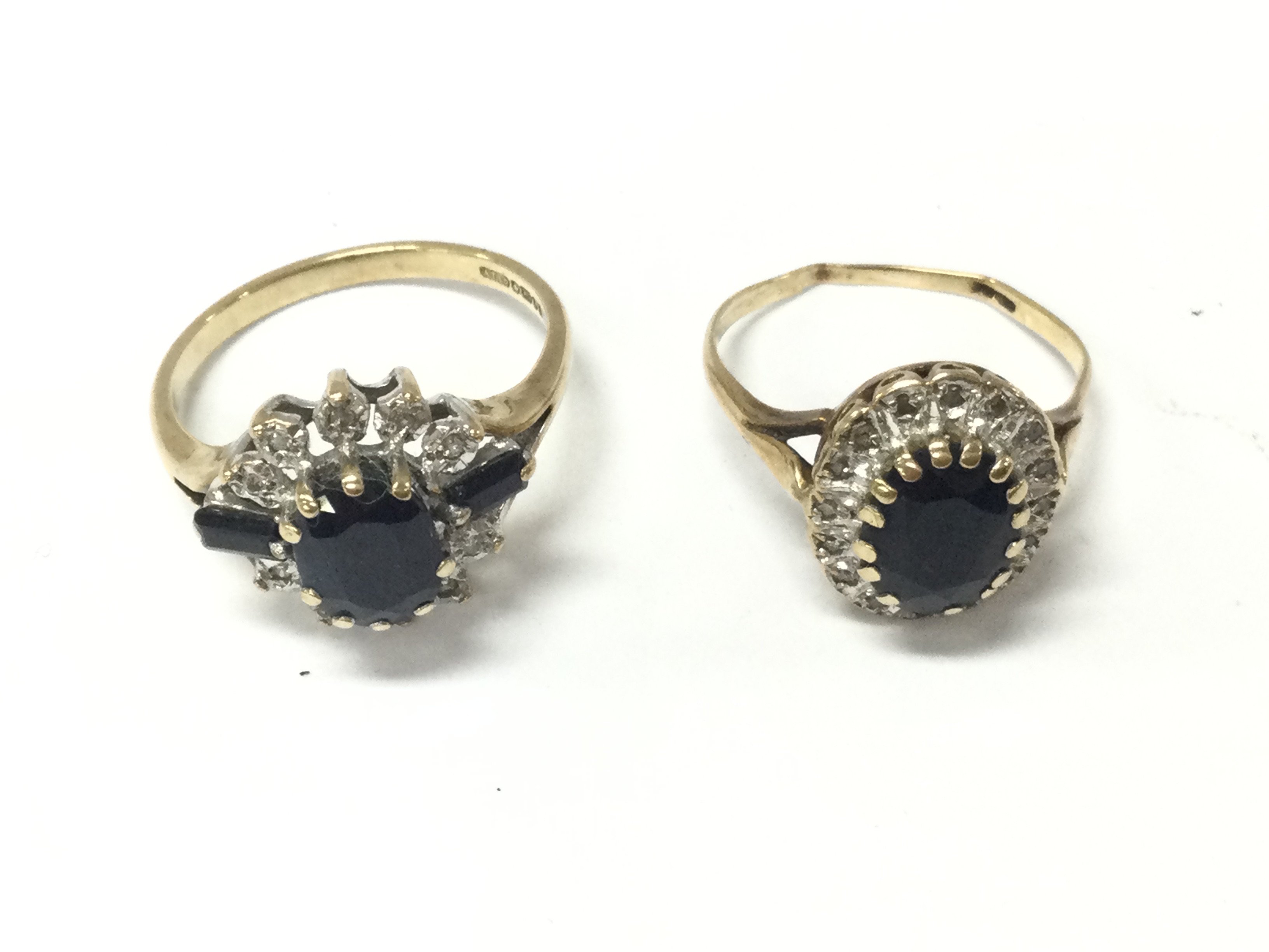 Two 9ct gold sapphire set gold rings. Size N and Size O. 5.77g Postage B