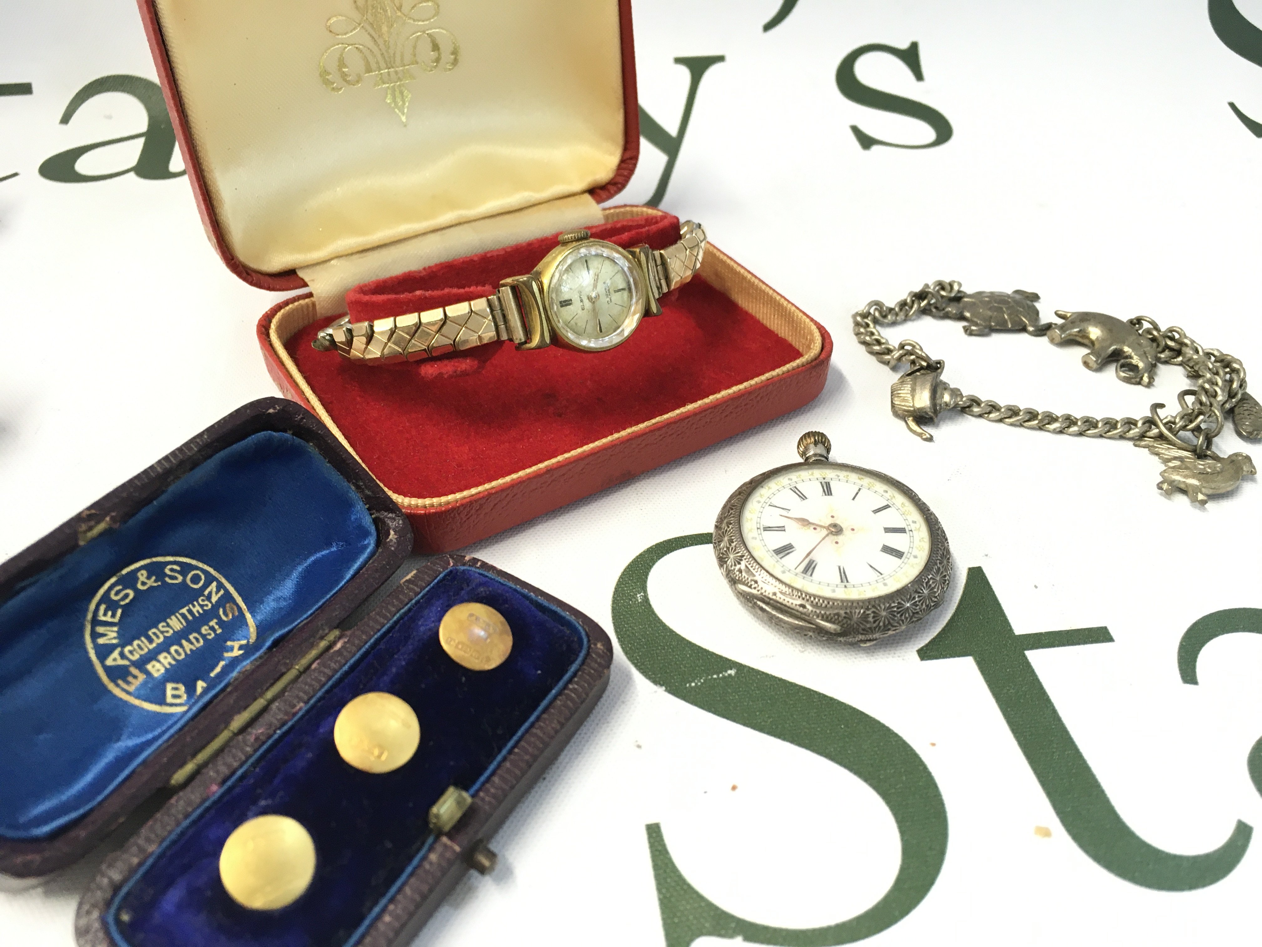 Small Silver cased pocket watch, Elbro vintage ladies watch , silver charm bracelet and cufflinks. Postage catA