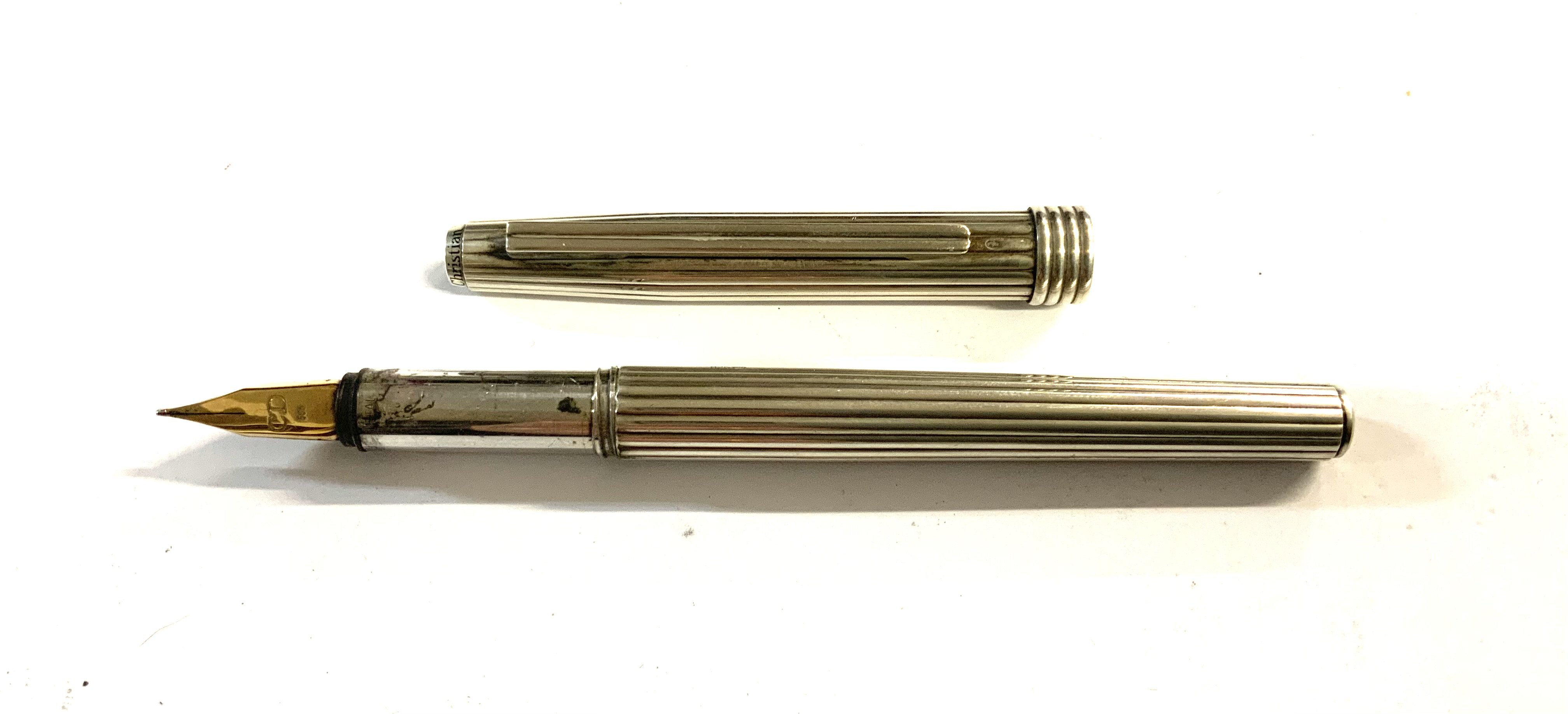 A Sterling silver Christian Dior fountain pen with a 14K gold nib. (A)- NO RESERVE