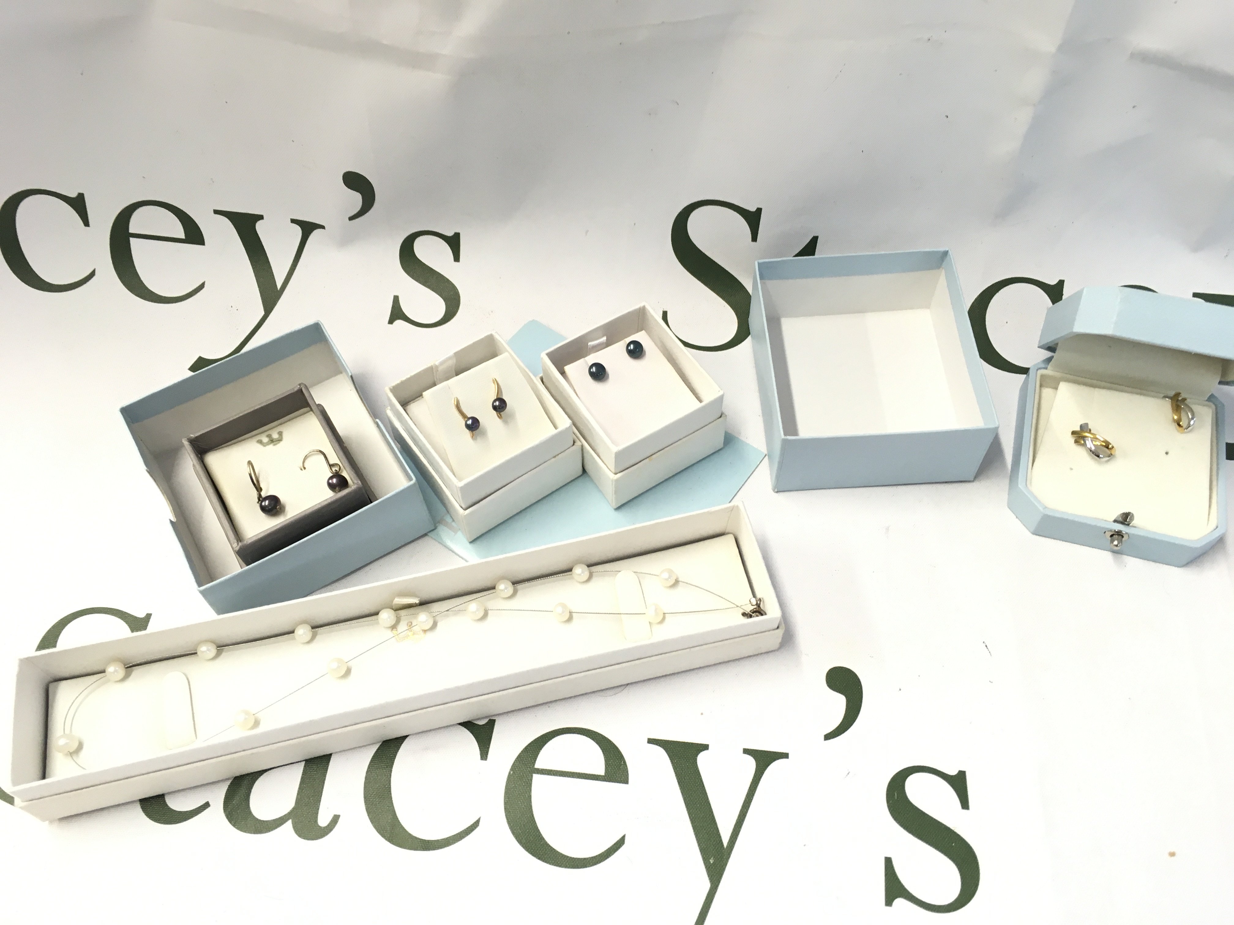 A collection of boxed jewellery including earrings (some 9ct gold), pearl silver necklace