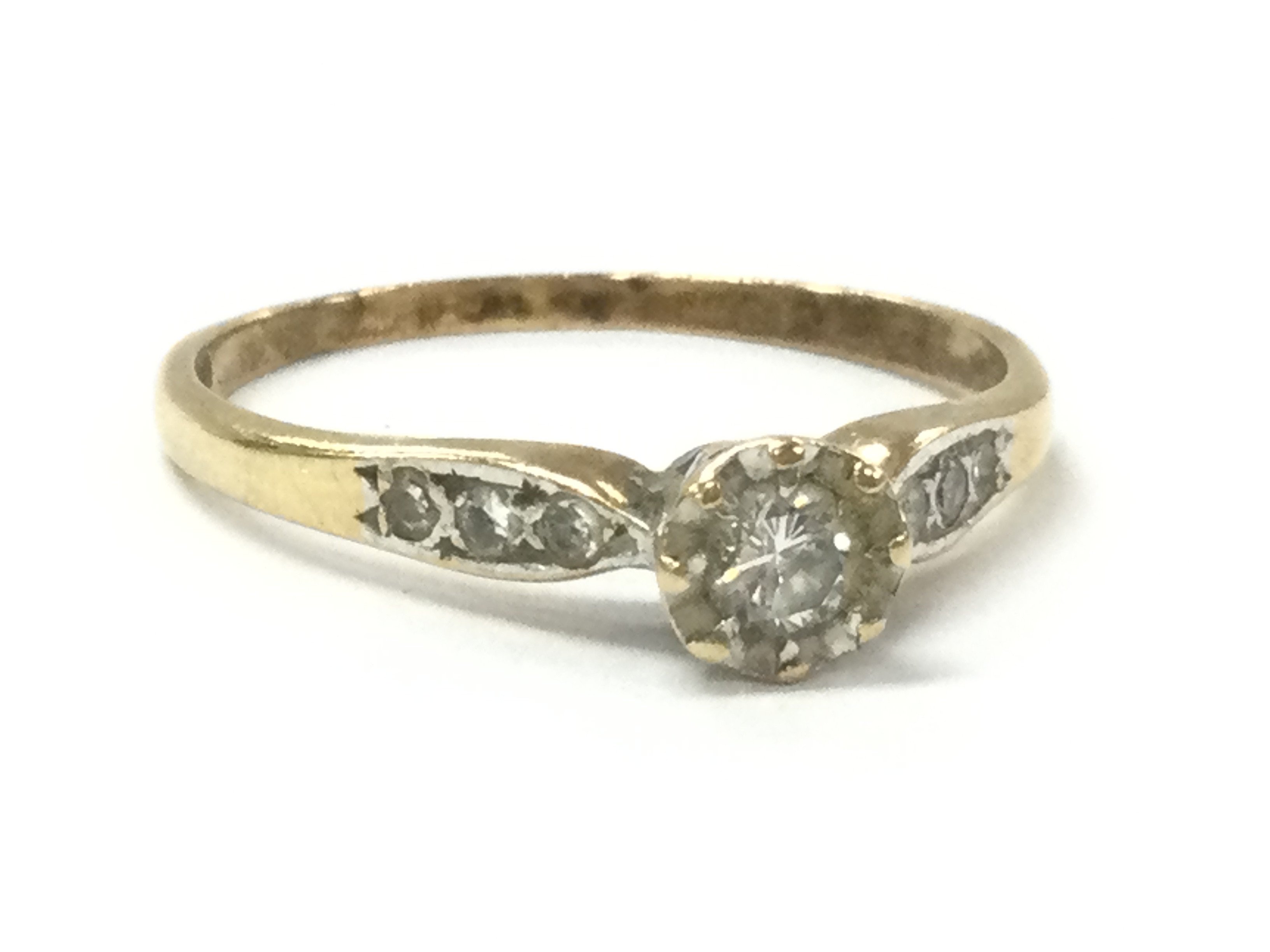 A 9 carat gold diamond ring, size P. 1.6g Postage category A