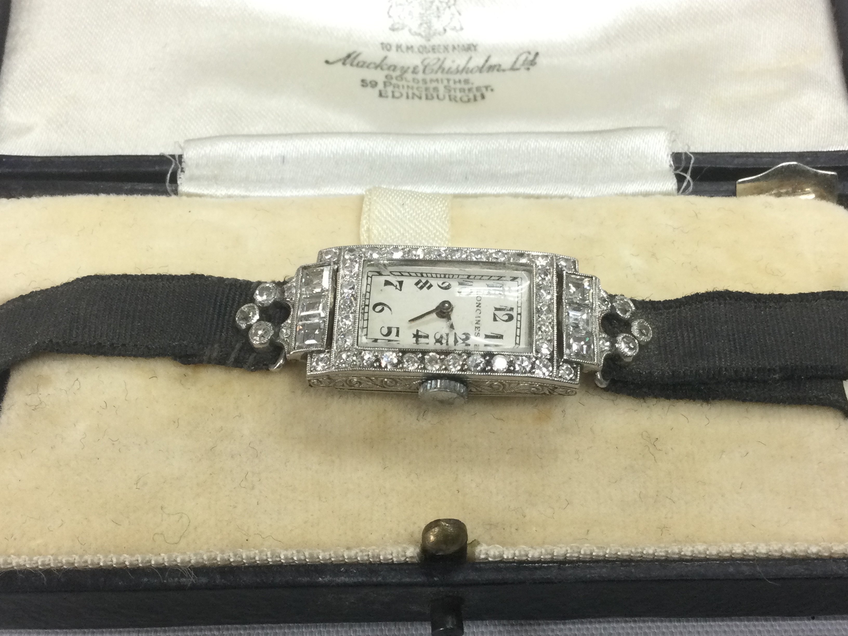 A 1930s Longines ladies cocktail watch, recently serviced. The watch is set with square and round old cut diamonds, approx 1.5ct in total, and with a platinum case. Shipping category A.
