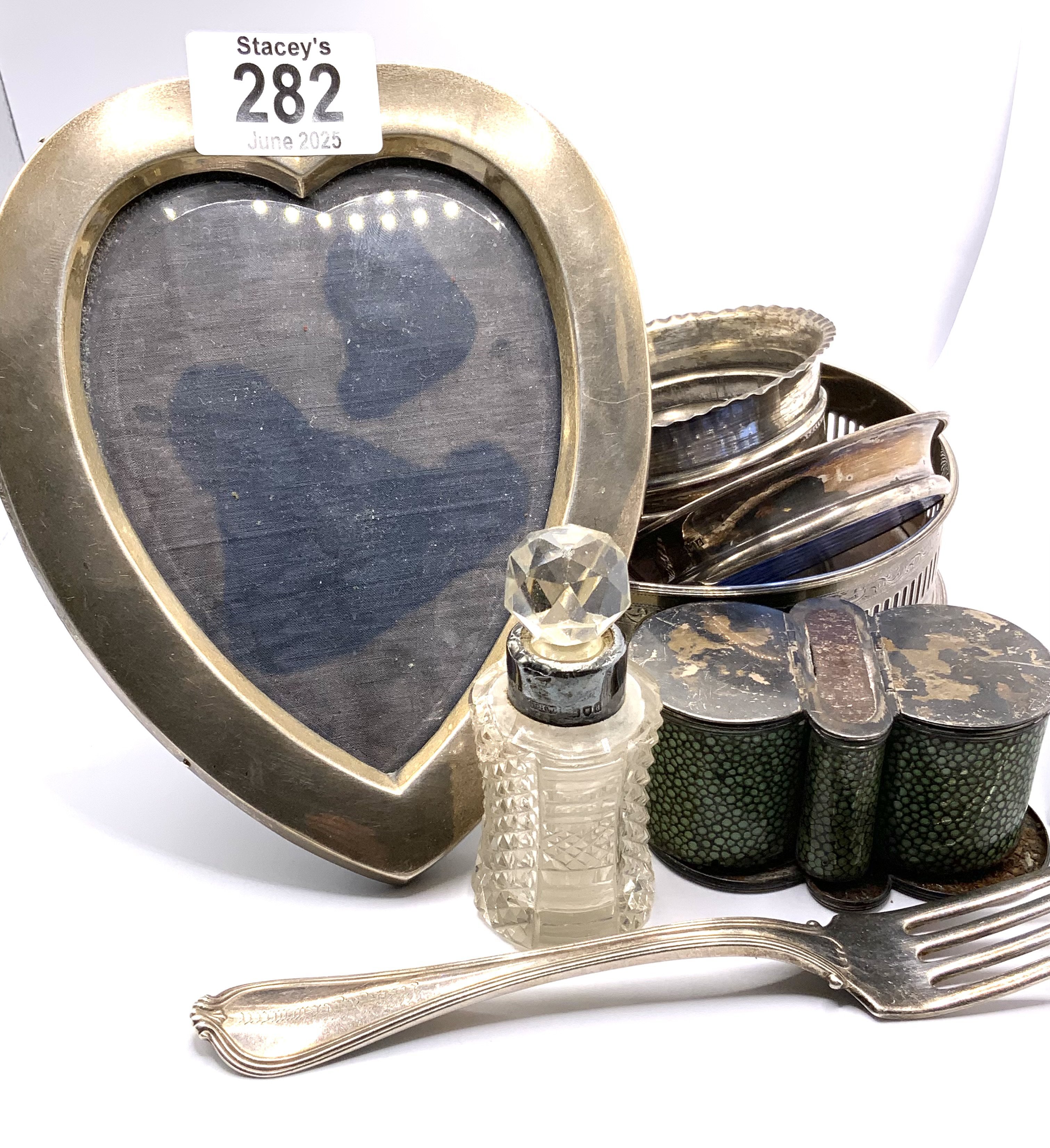 A mixed lot of hallmarked silver articles including a silver wine bottle coaster. (B)