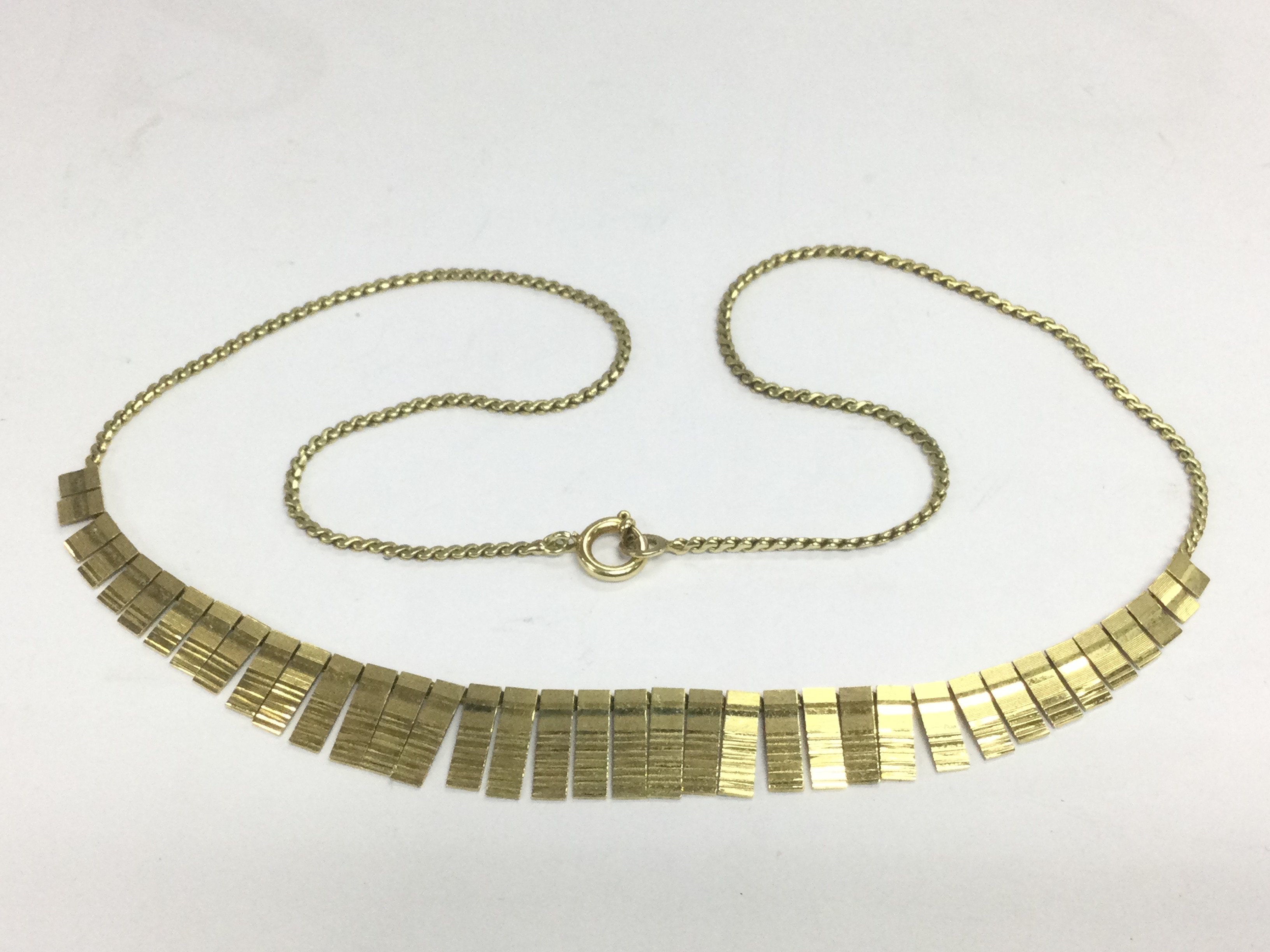 A 14ct gold modern design necklace, approx 11.7g. Shipping category A.