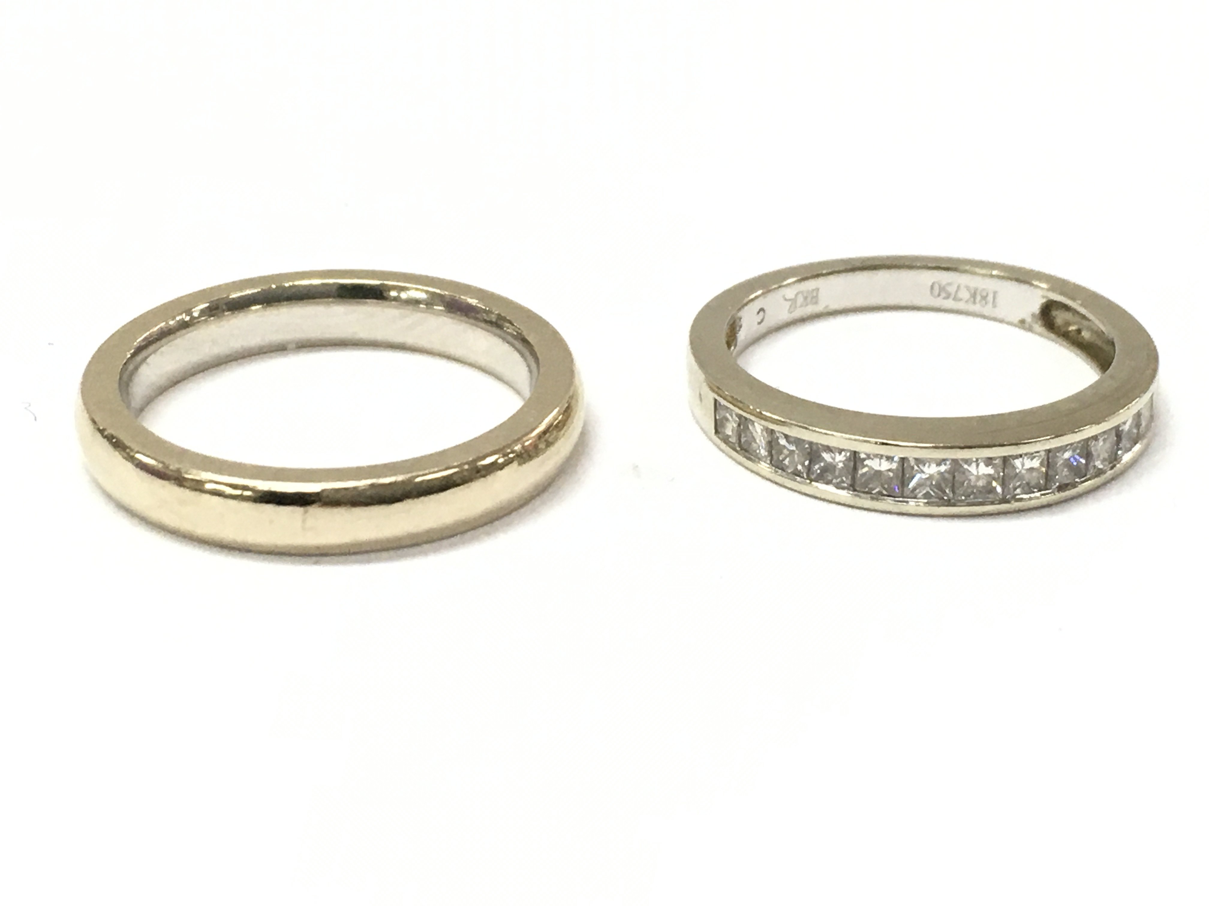 An 18ct diamond half eternity ring & an 18ct wedding band, 7.3g total weight. Postage category A