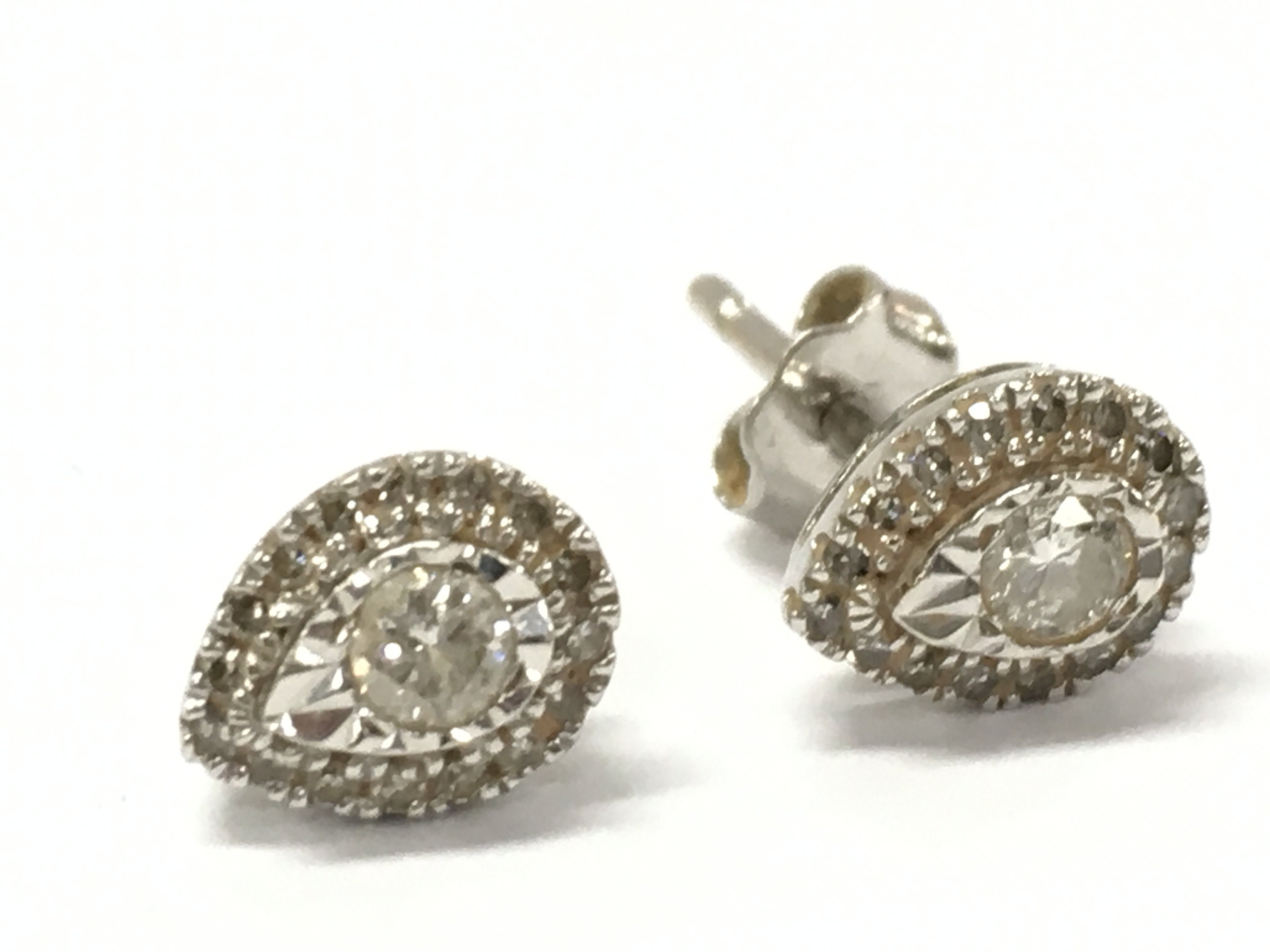 9ct gold tear drop diamond studs, one damaged . Total weight 1.18g . Postage category A