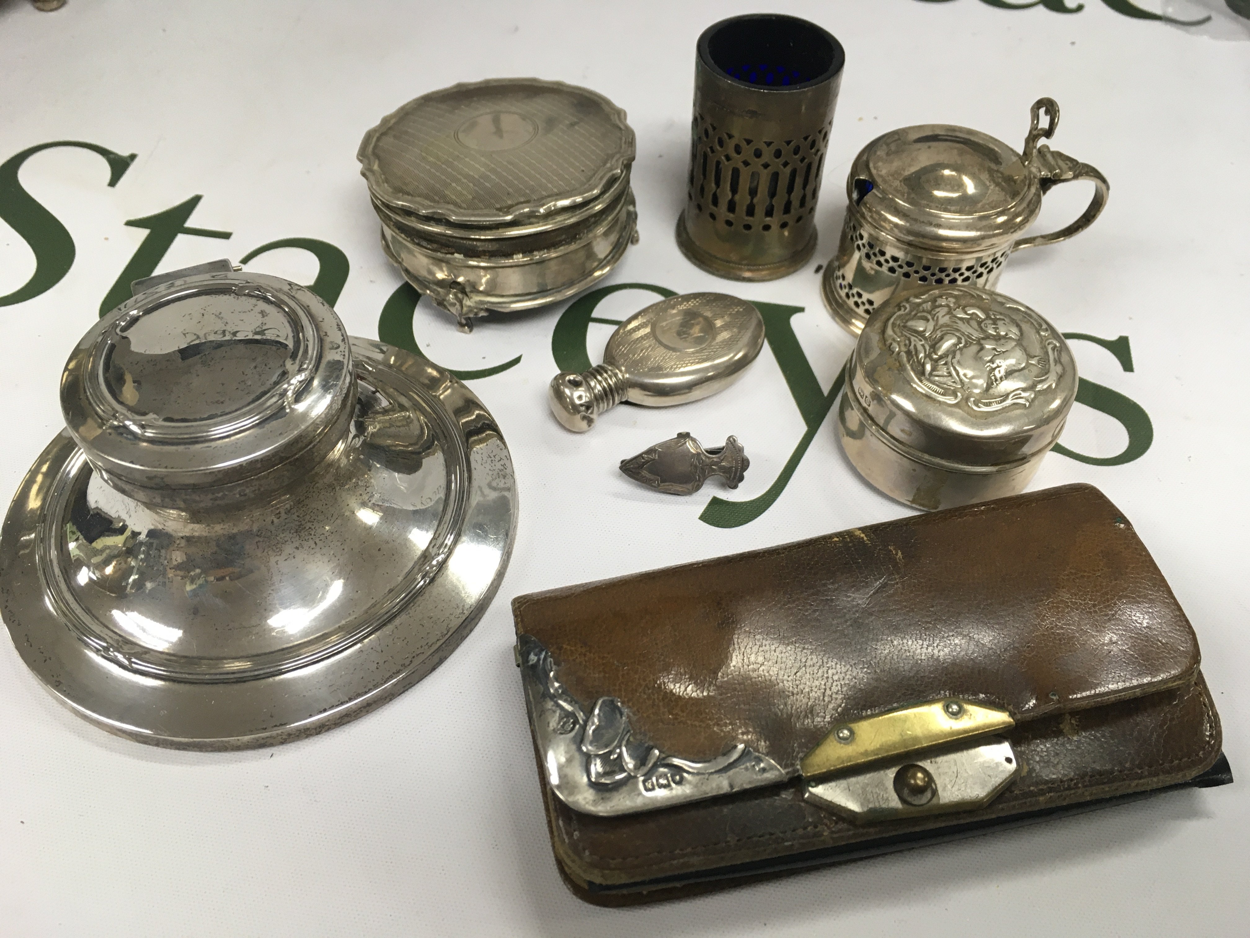 An assortment of silver items including condiments and other items.