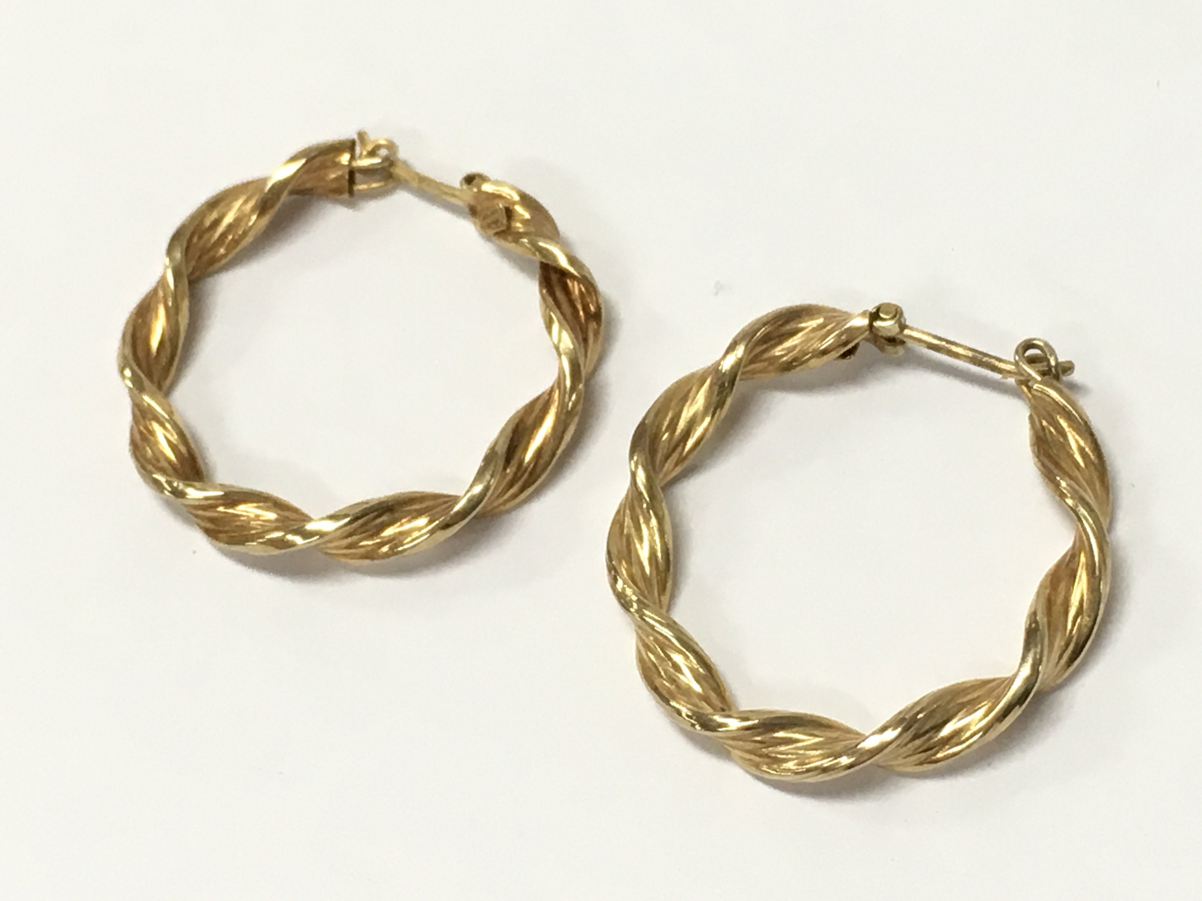 Pair of 9 carat gold hoop earrings , 2.2g total weight postage category A