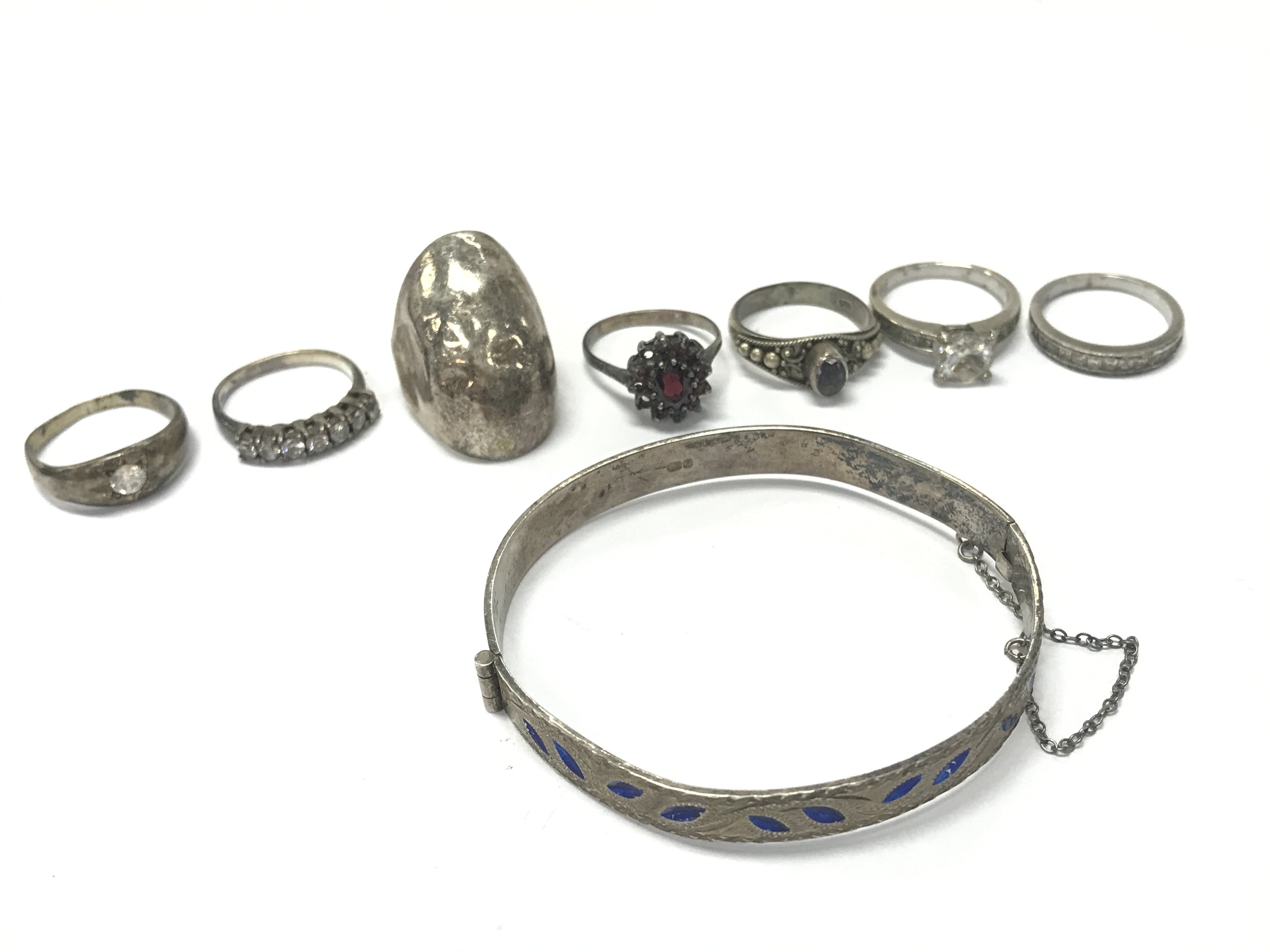 Silver rings and a silver bangle. Postage category A