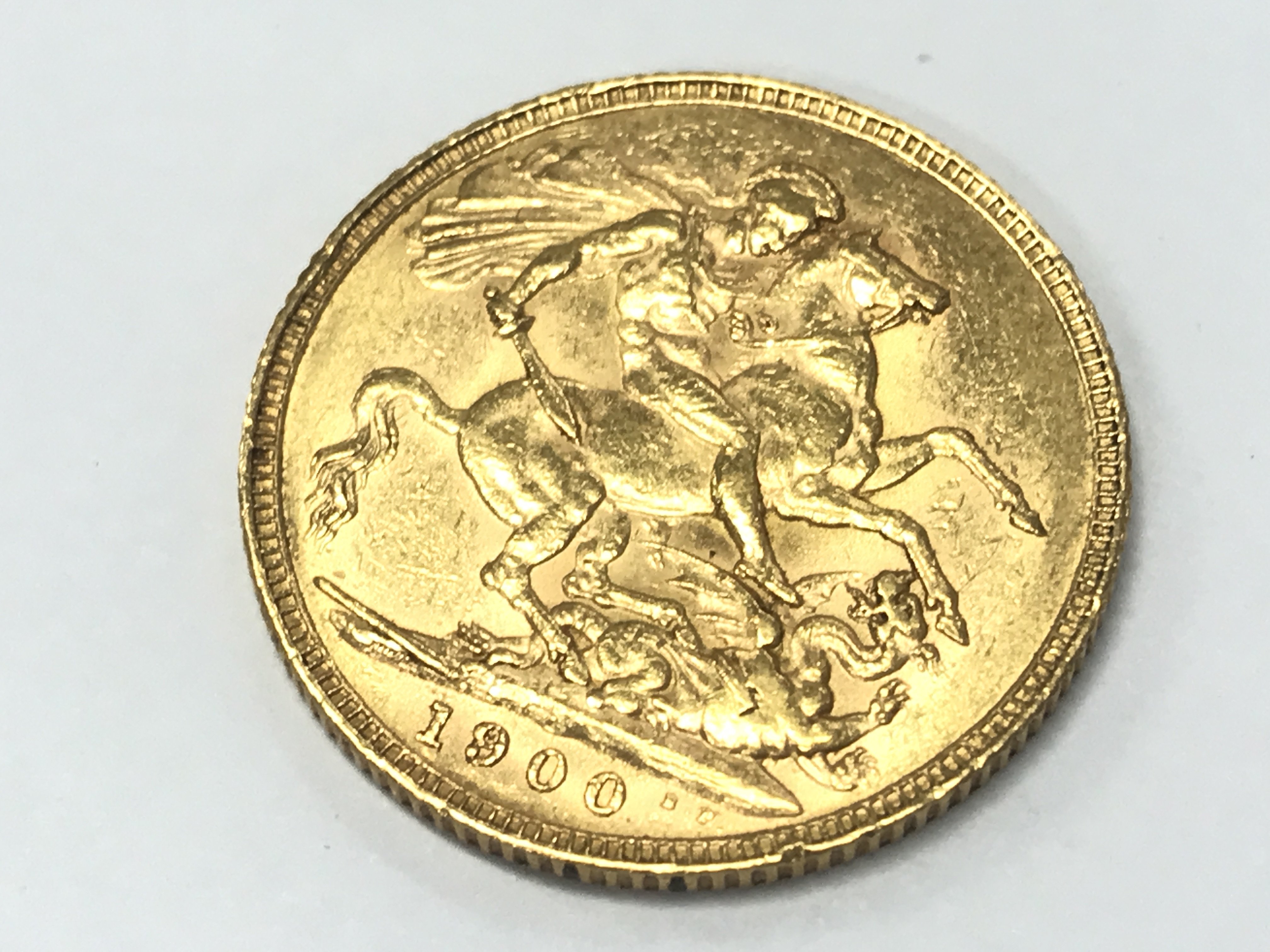 A 1900 gold sovereign , postage cat A