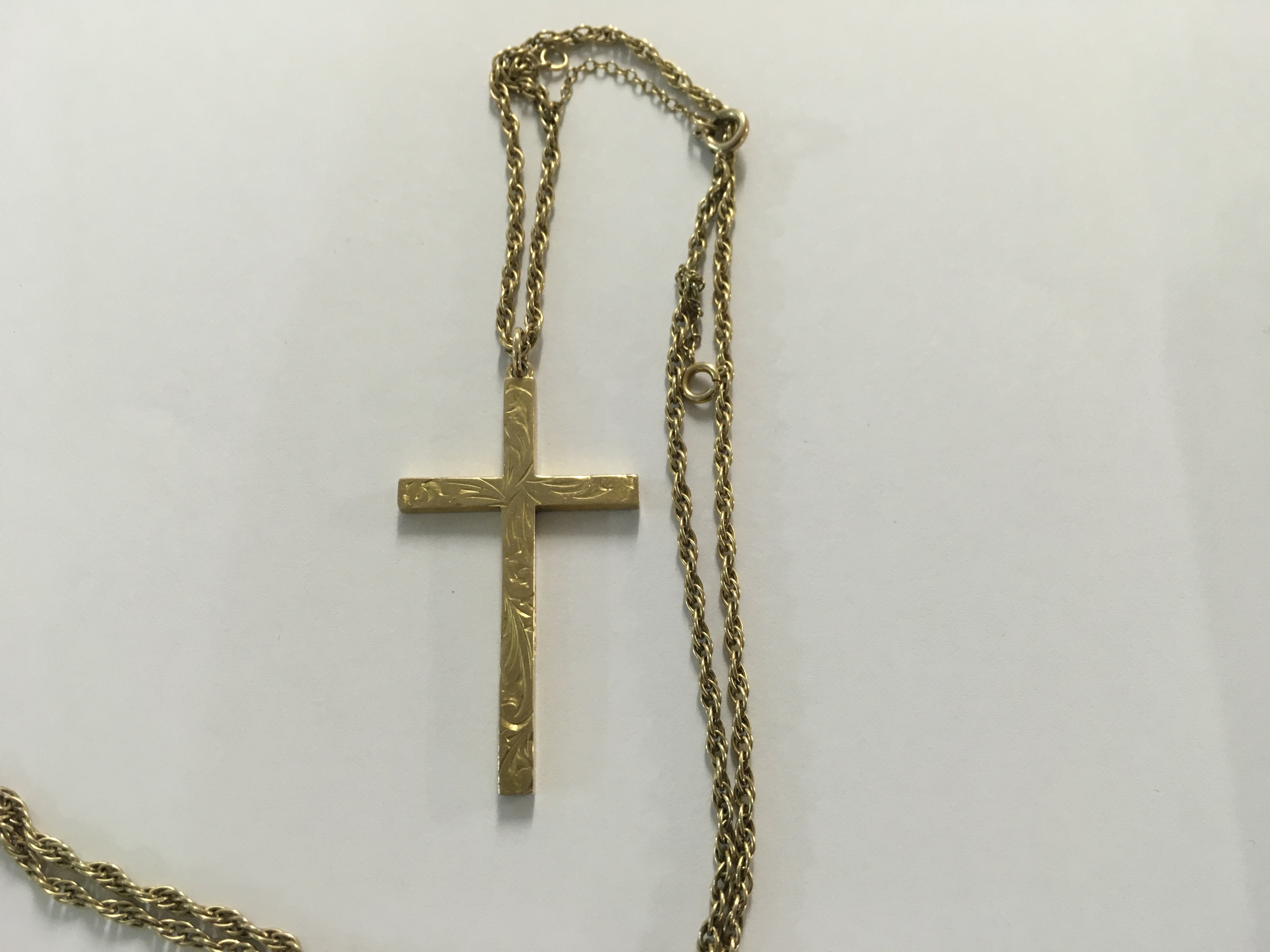 A 9ct cross on chain 12.5 grams.
