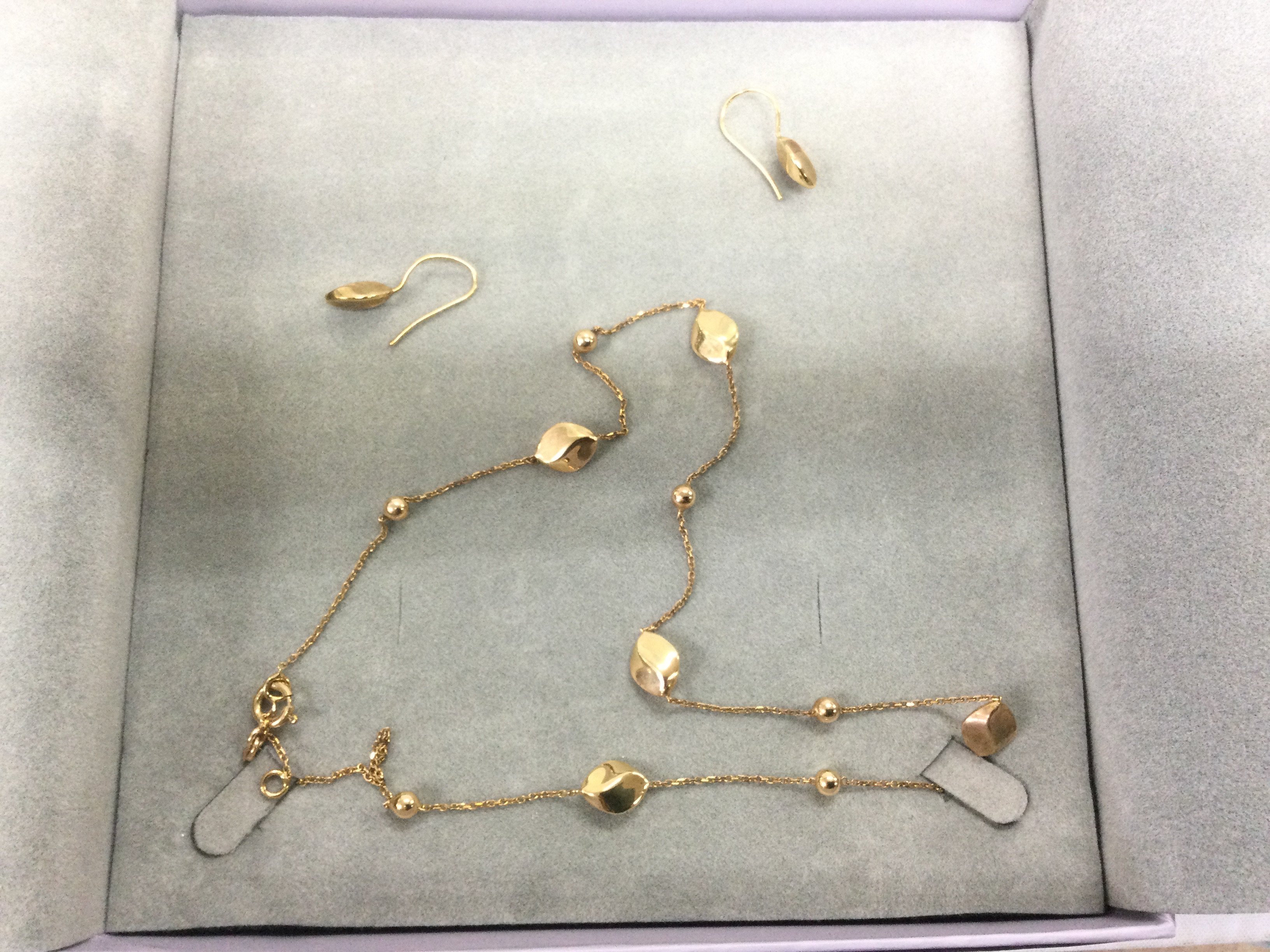 A small collection of mixed gold earrings and pendants. Shipping category A.