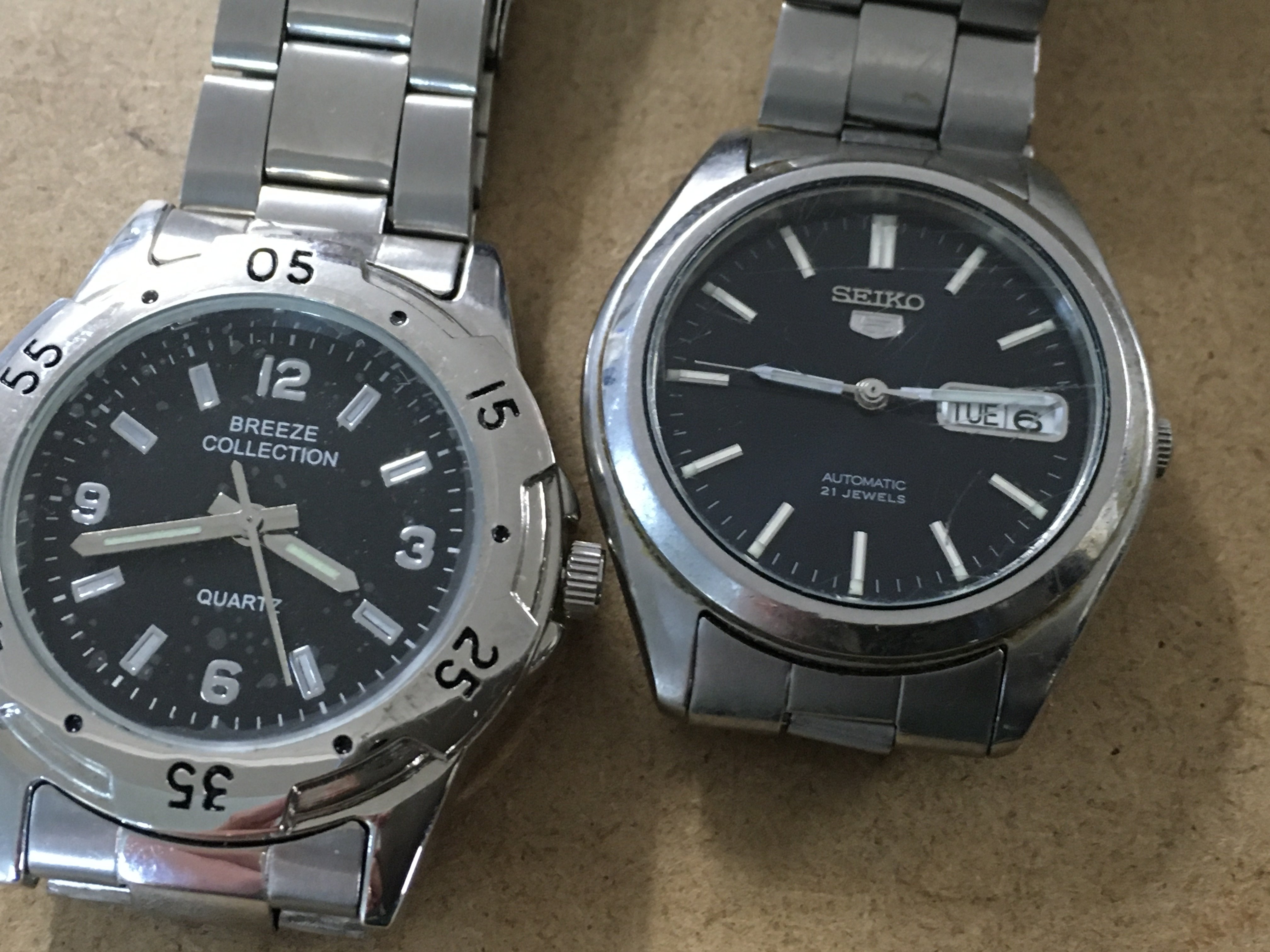 A collection of cufflinks a silver pendant on chain and two watches.