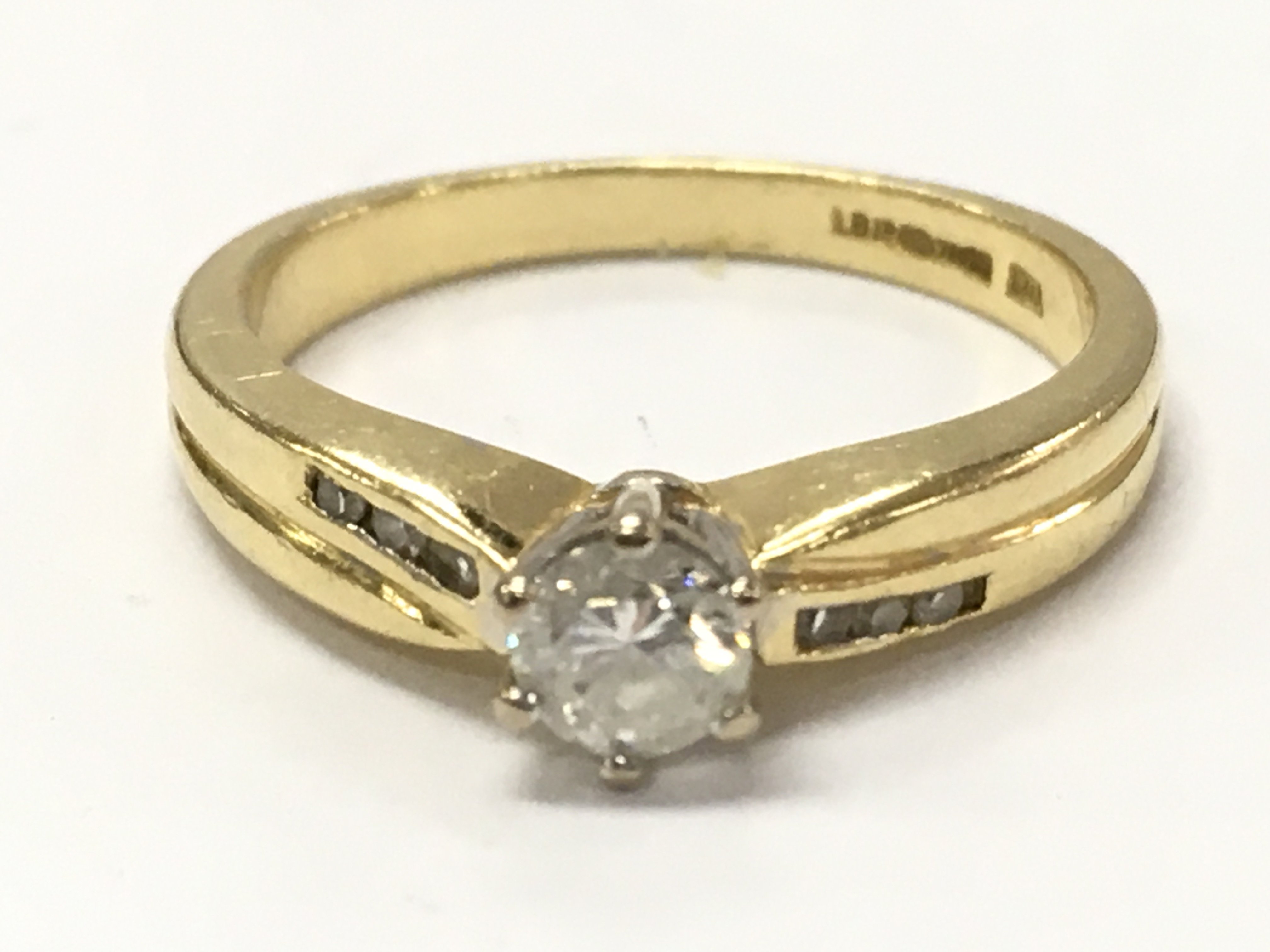 An 18ct gold diamond solitaire ring , 3.8g total weight. Size L Postage category A