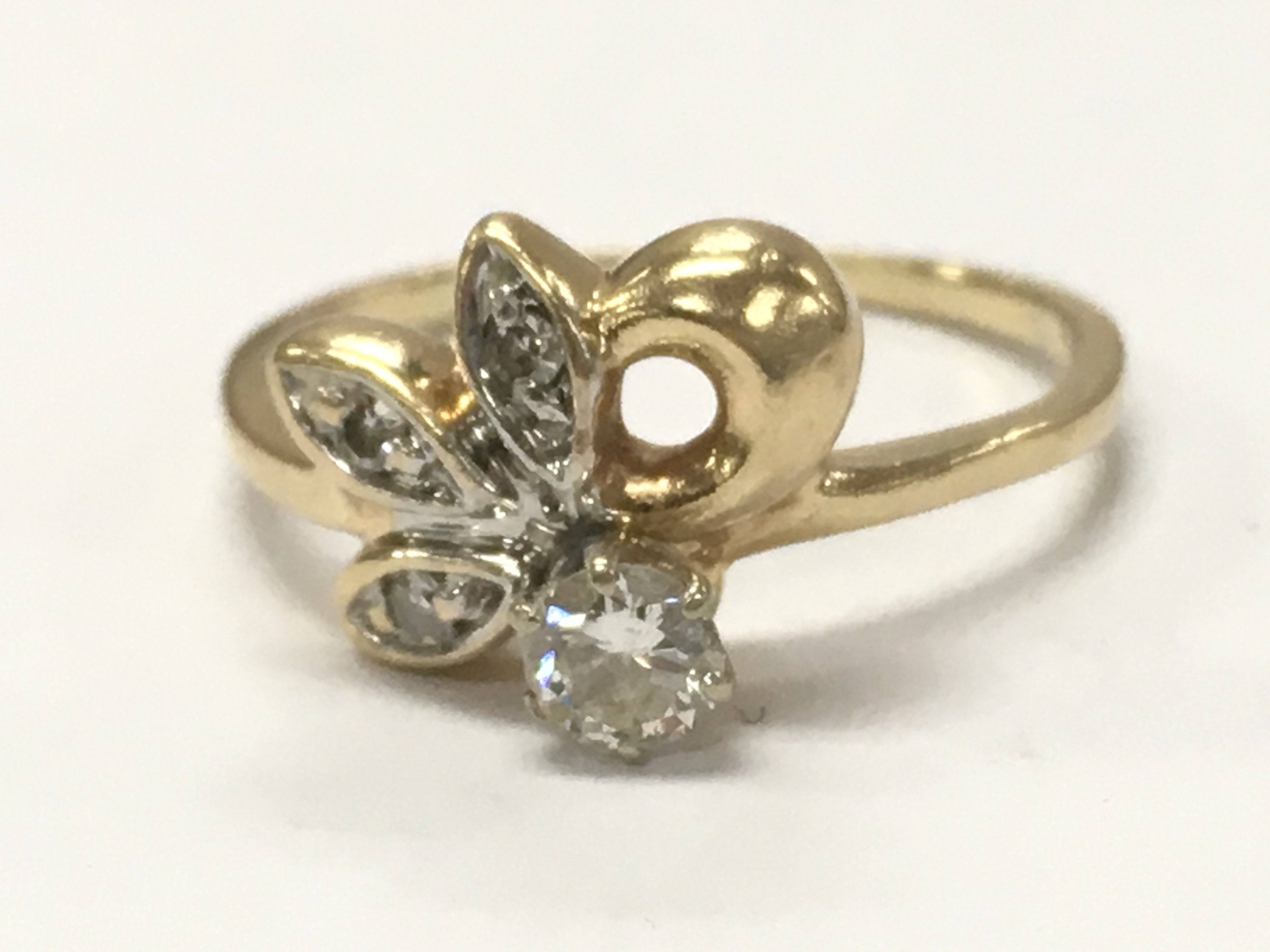 A 14ct gold diamond cluster ring , 2.9g total weight . Size N. Postage category A