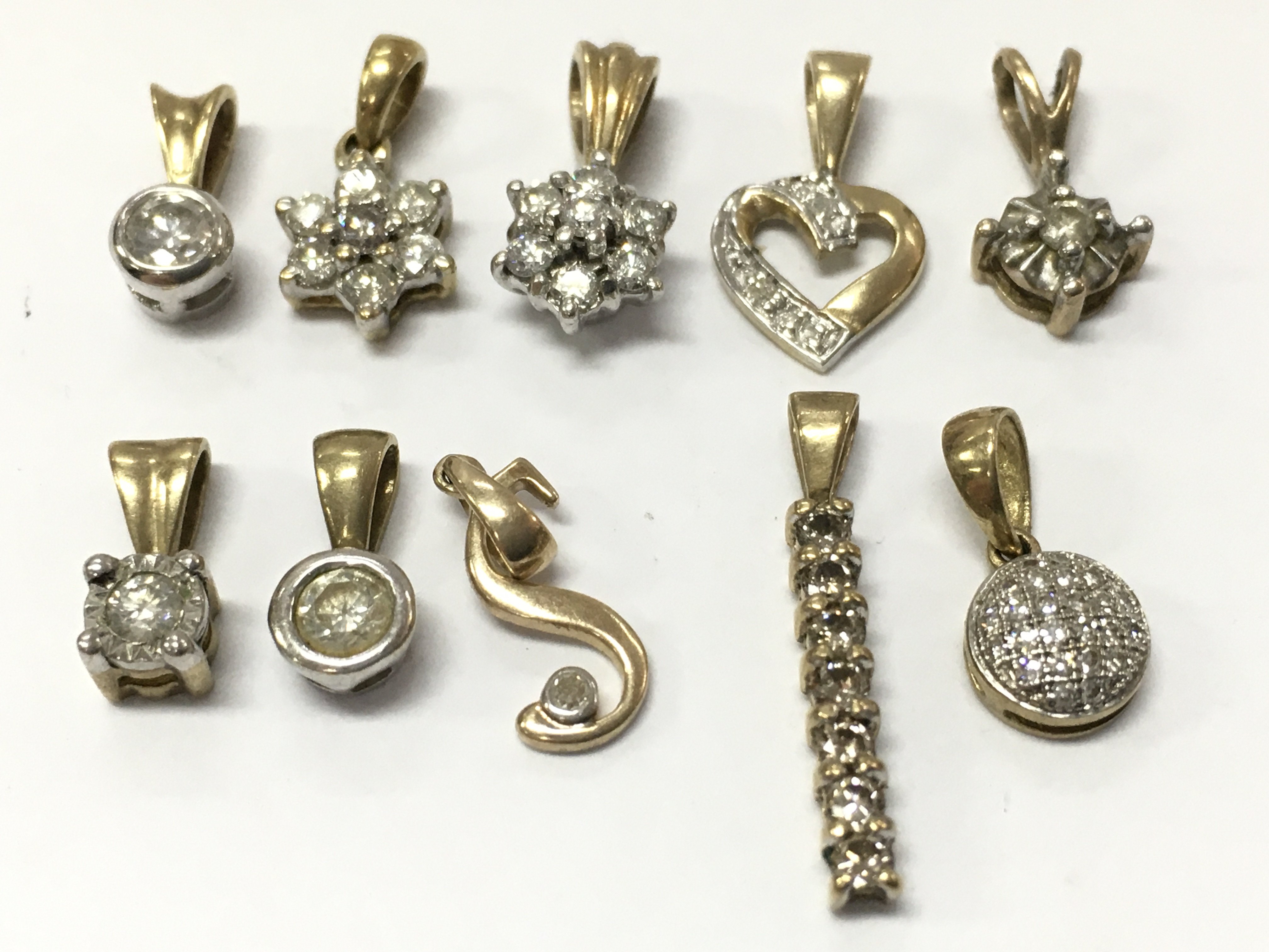 9ct gold diamond pendants , 4.7g total weight, postage category A
