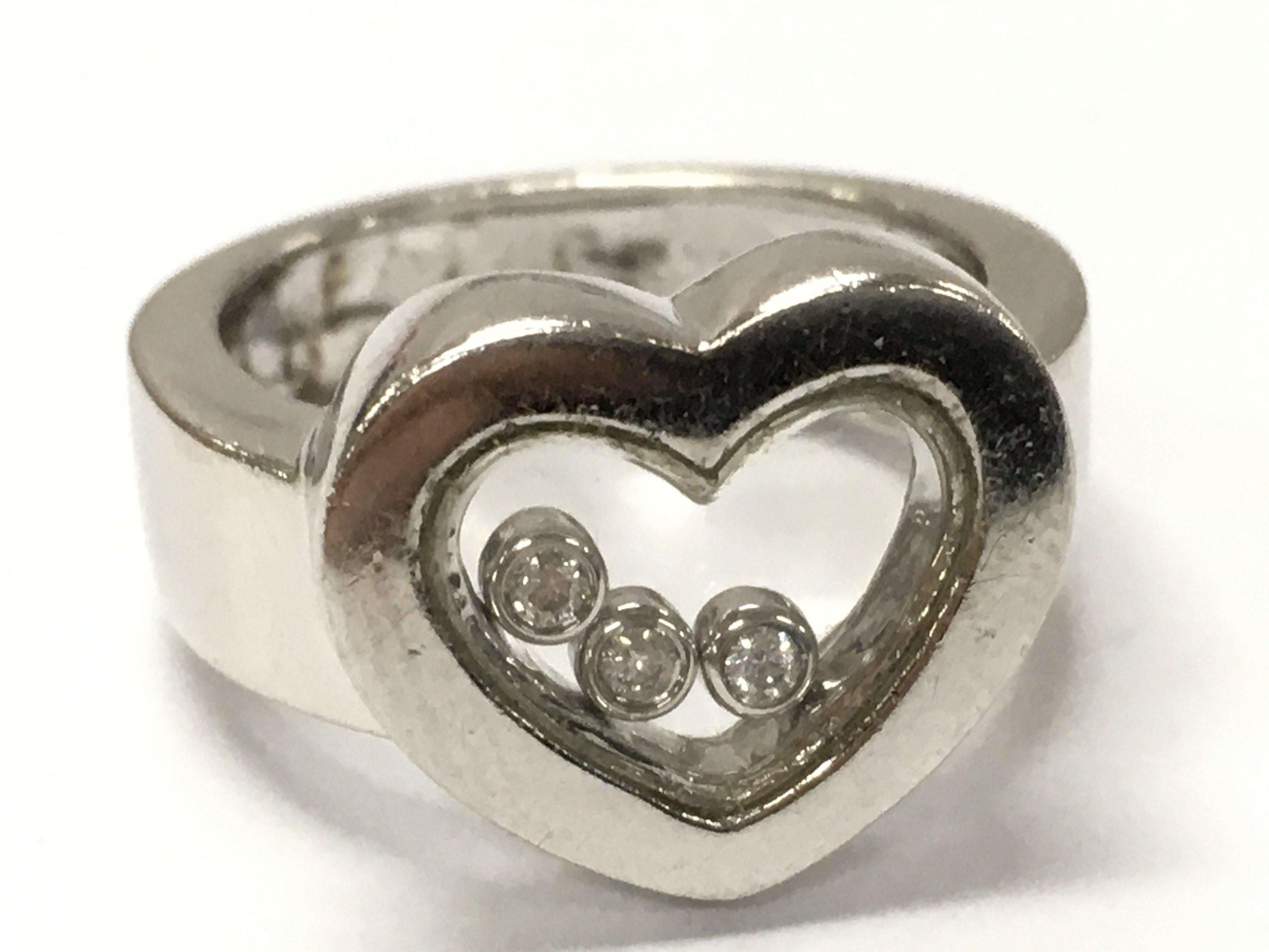 9ct white gold floating diamonds heart ring, size N . 7.9g total weight Postage category A