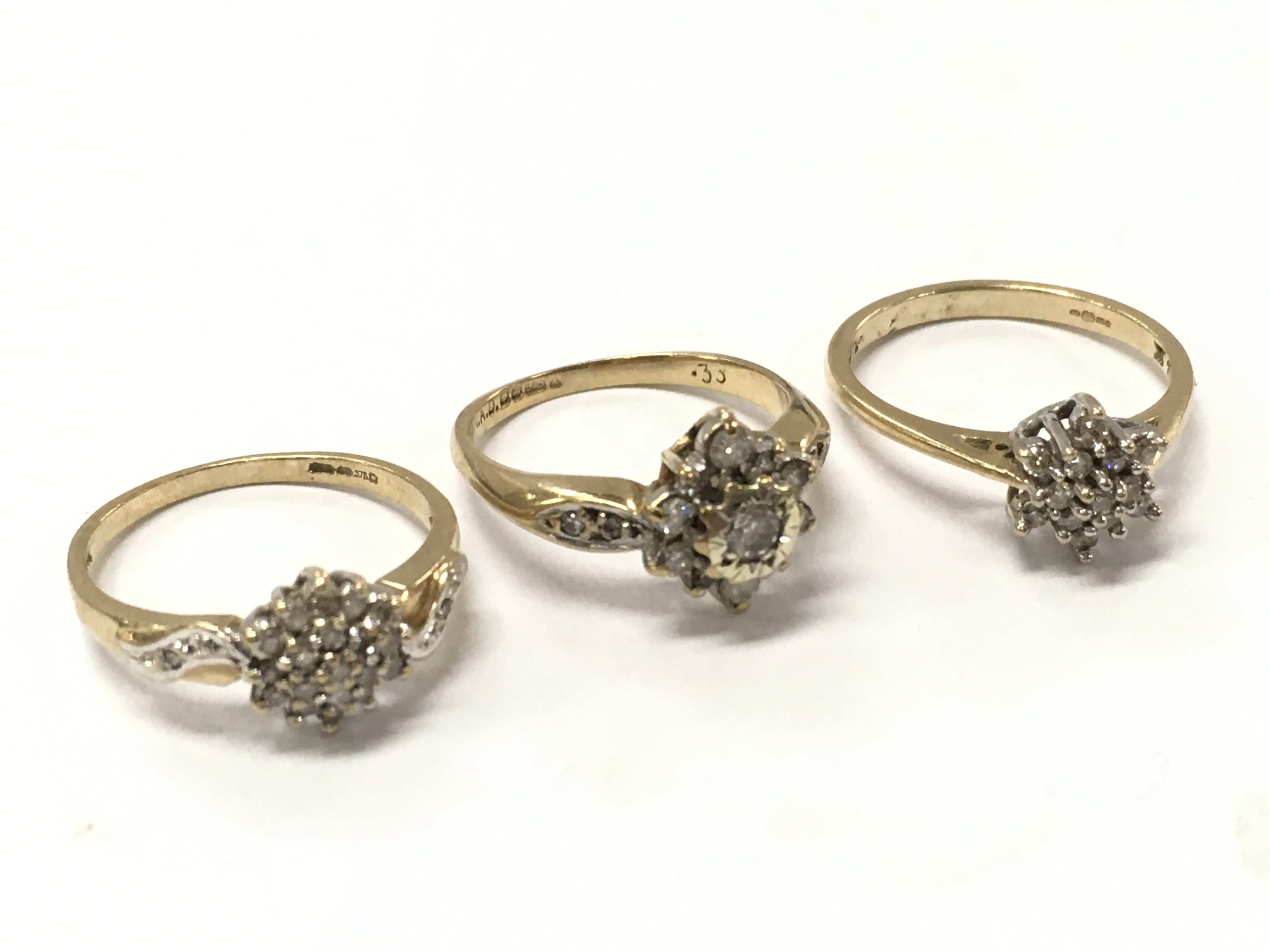 9ct gold diamond cluster rings, 6.4g total weight. Size m, h, l .Postage category A
