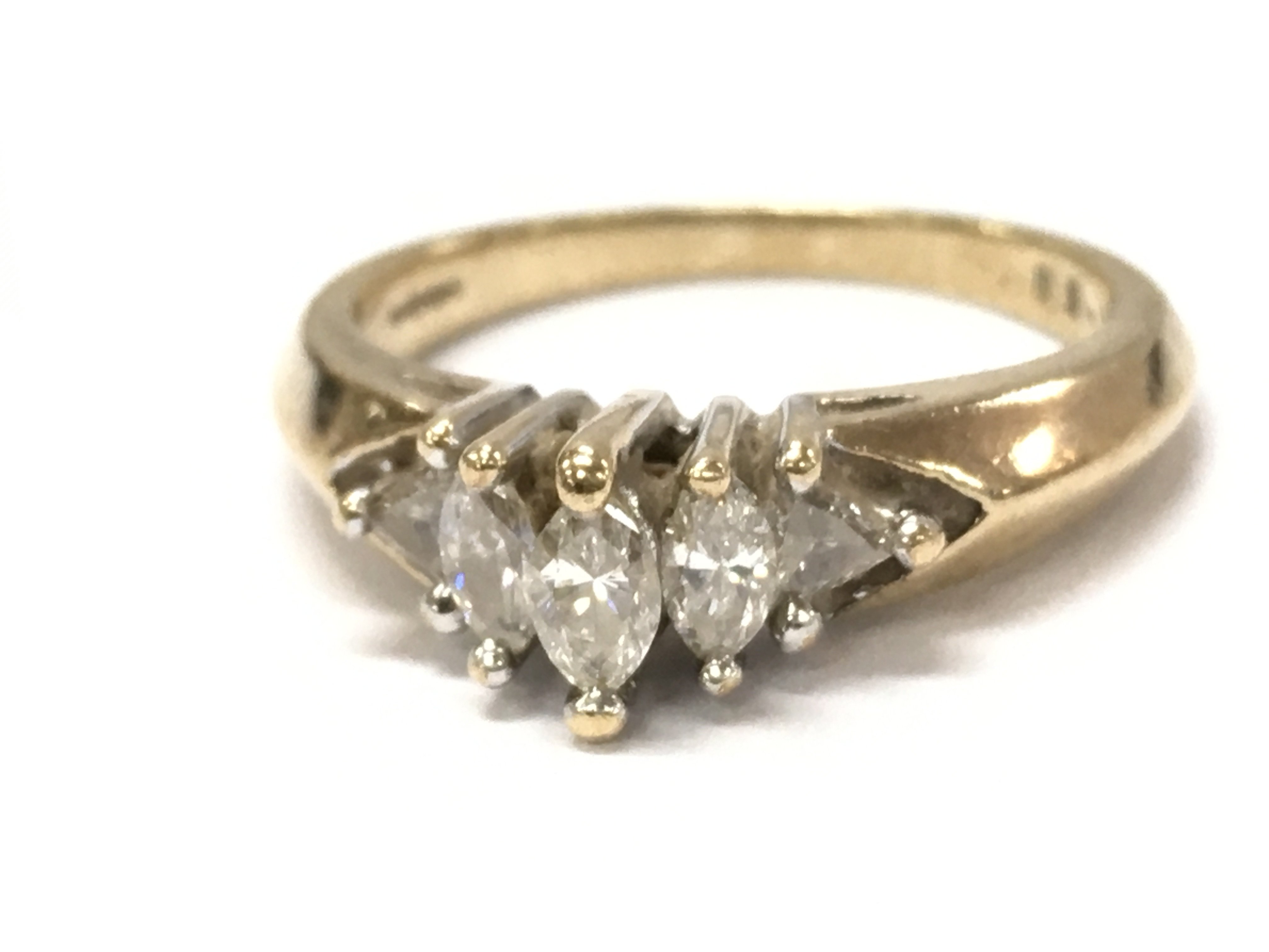A 9ct gold marquise/ triangle 5 stone diamond ring, 3.4g total weight. N/O. Postage category A