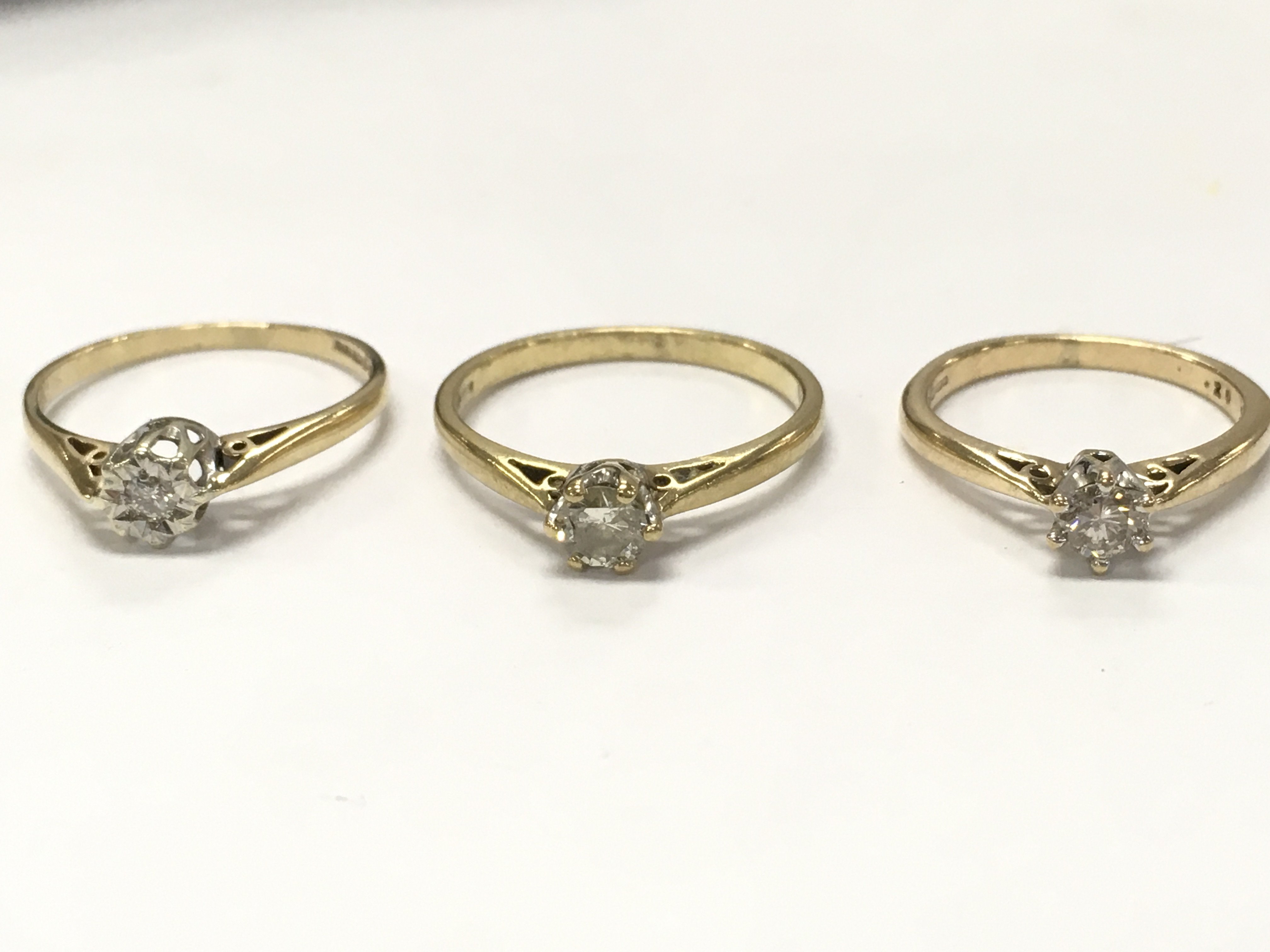 9ct gold diamond solitaire rings, 4.7g total weight. Size I, N, L. Postage category a