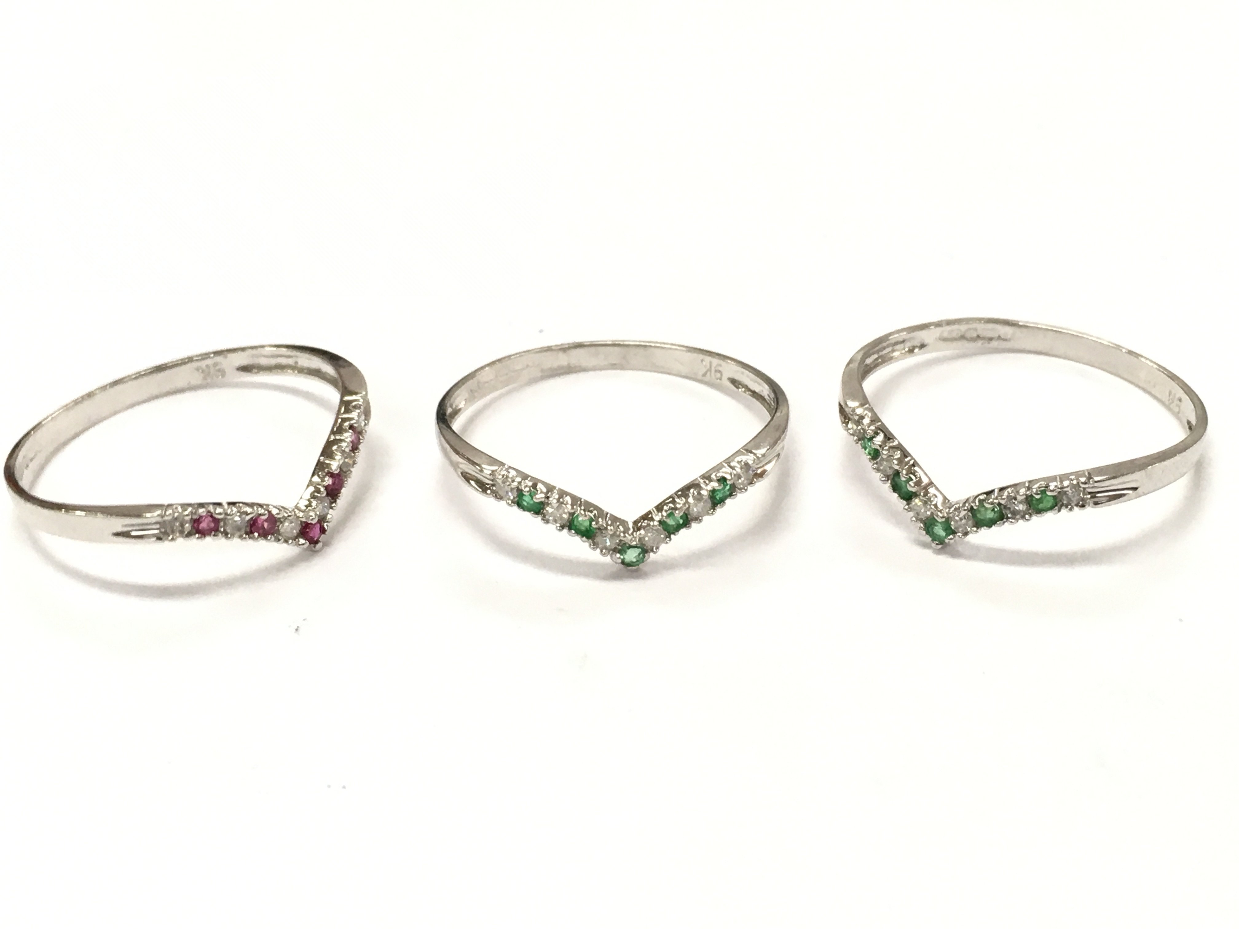 9ct white gold diamond and emerald rings, ruby wishbone ring . Size O. 2.2g total weight postage category A