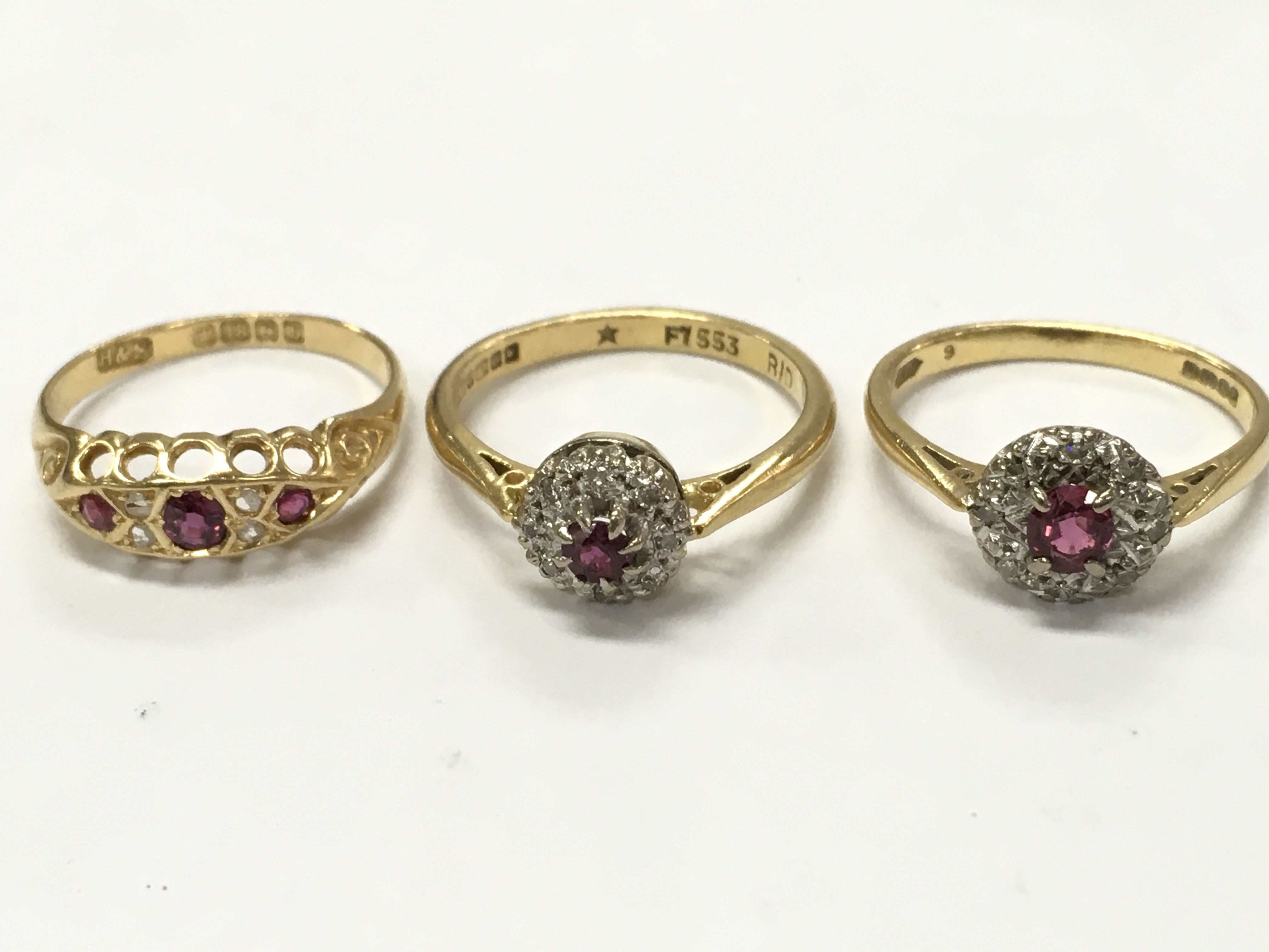 18ct gold diamond and ruby cluster rings. 9g total weight. Size K, N, M Postage category A