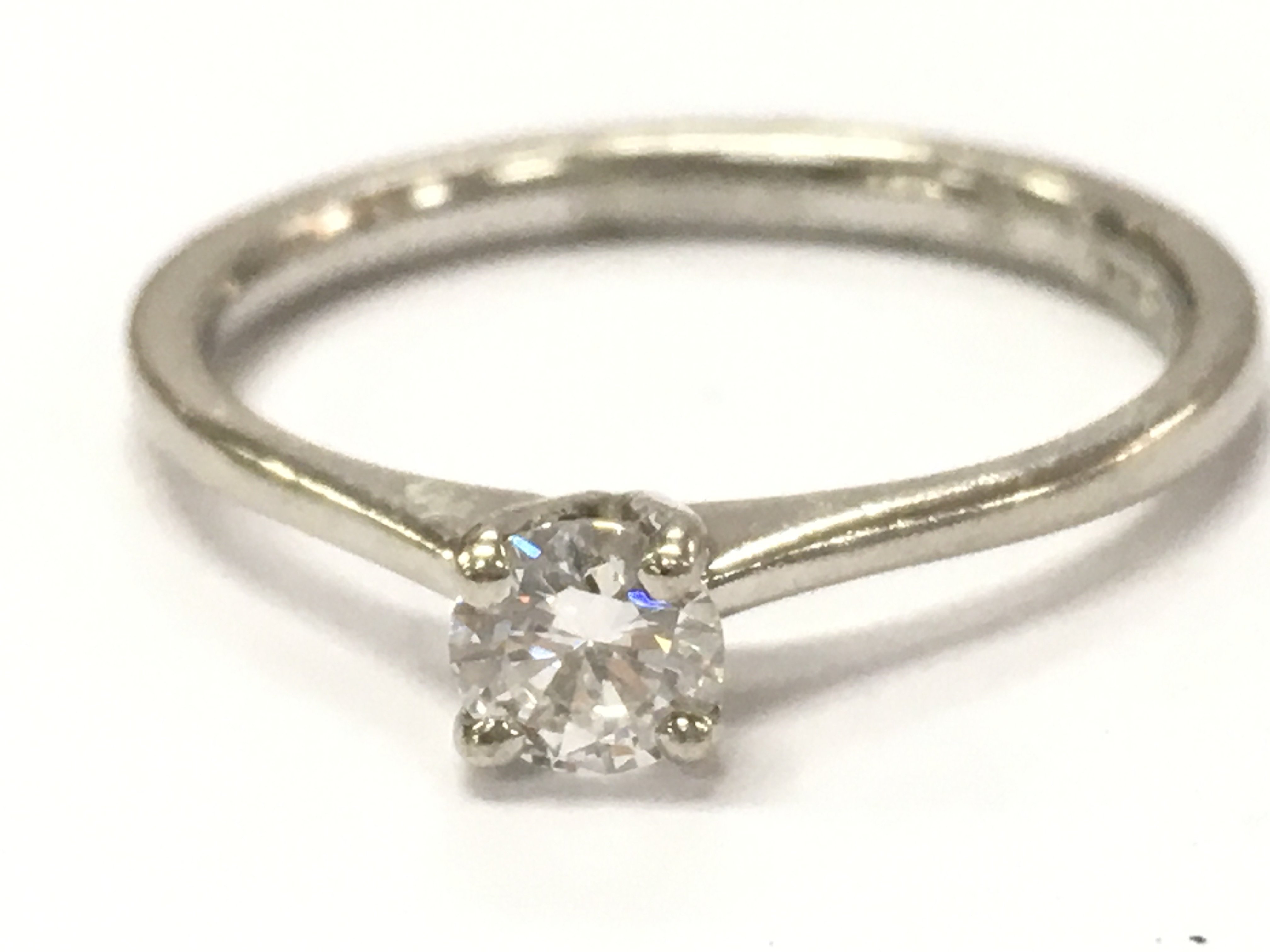A platinum diamond solitaire ring , 3.6g total weight. Size N/O Postage category A