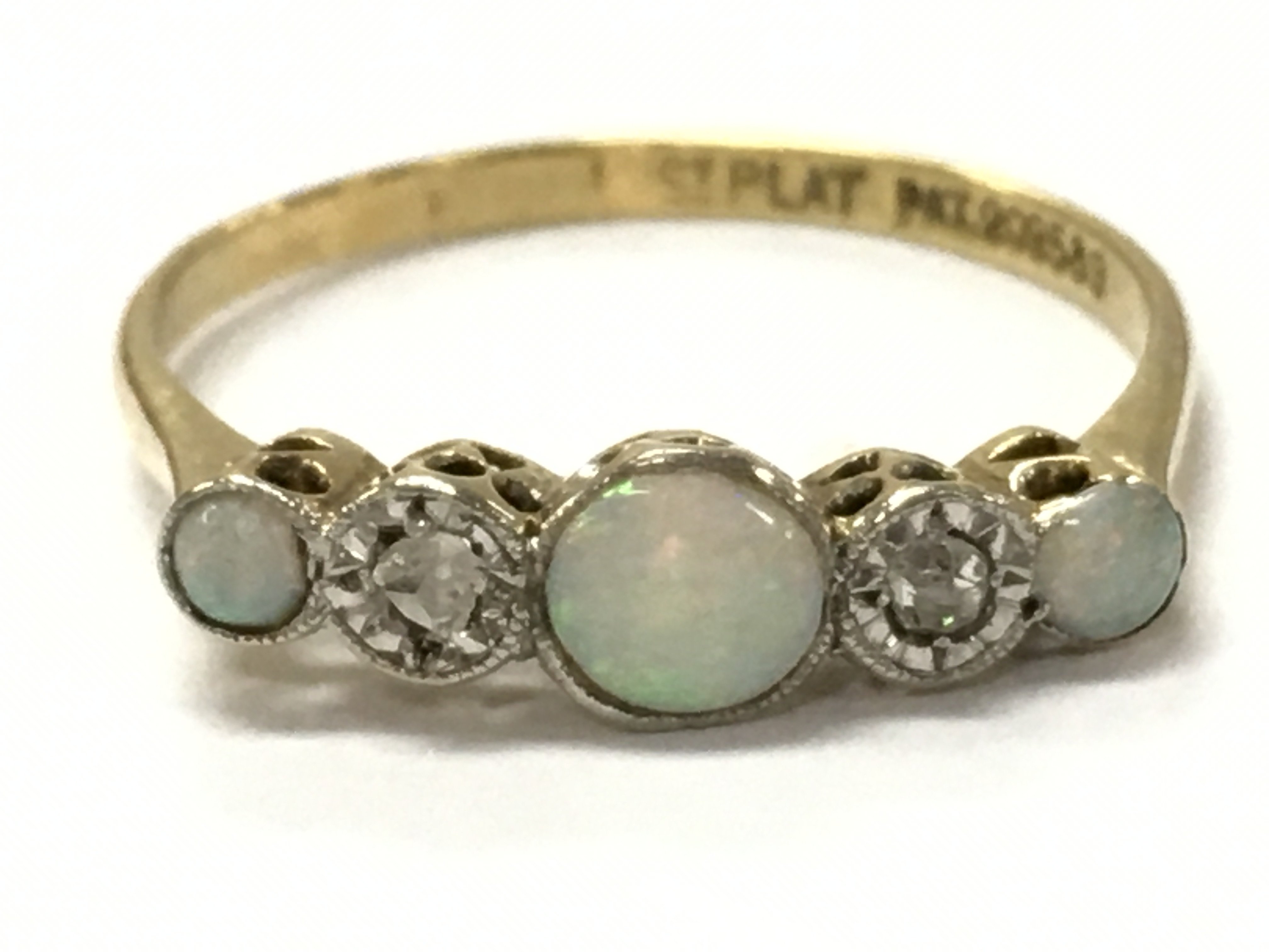 An 18ct gold diamond / opal 5 stone ring. Size S. 2.3G total weight postage category A