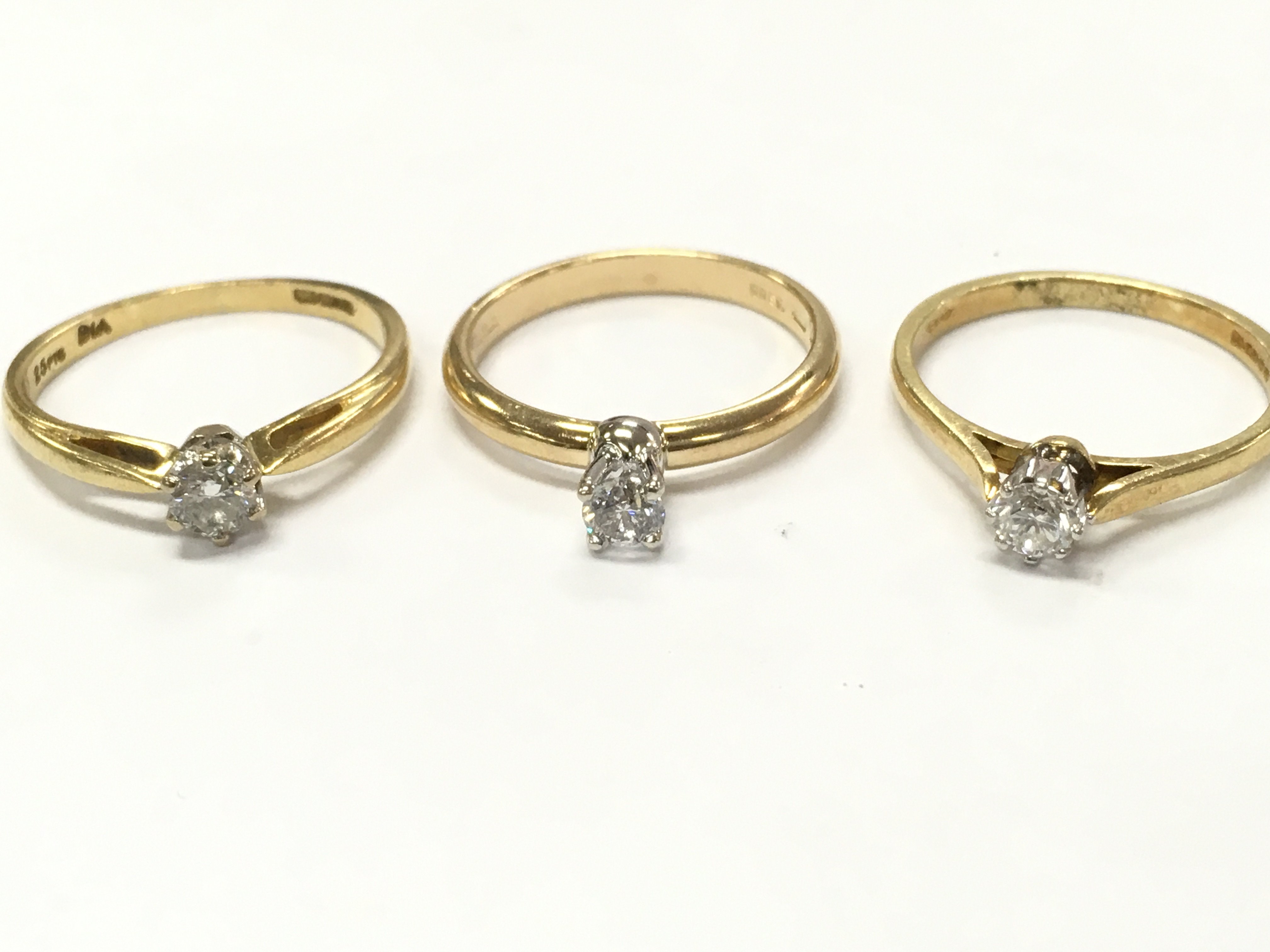 18ct gold diamond solitaire rings size M , N, O. 7.9g total weight. Postage category A