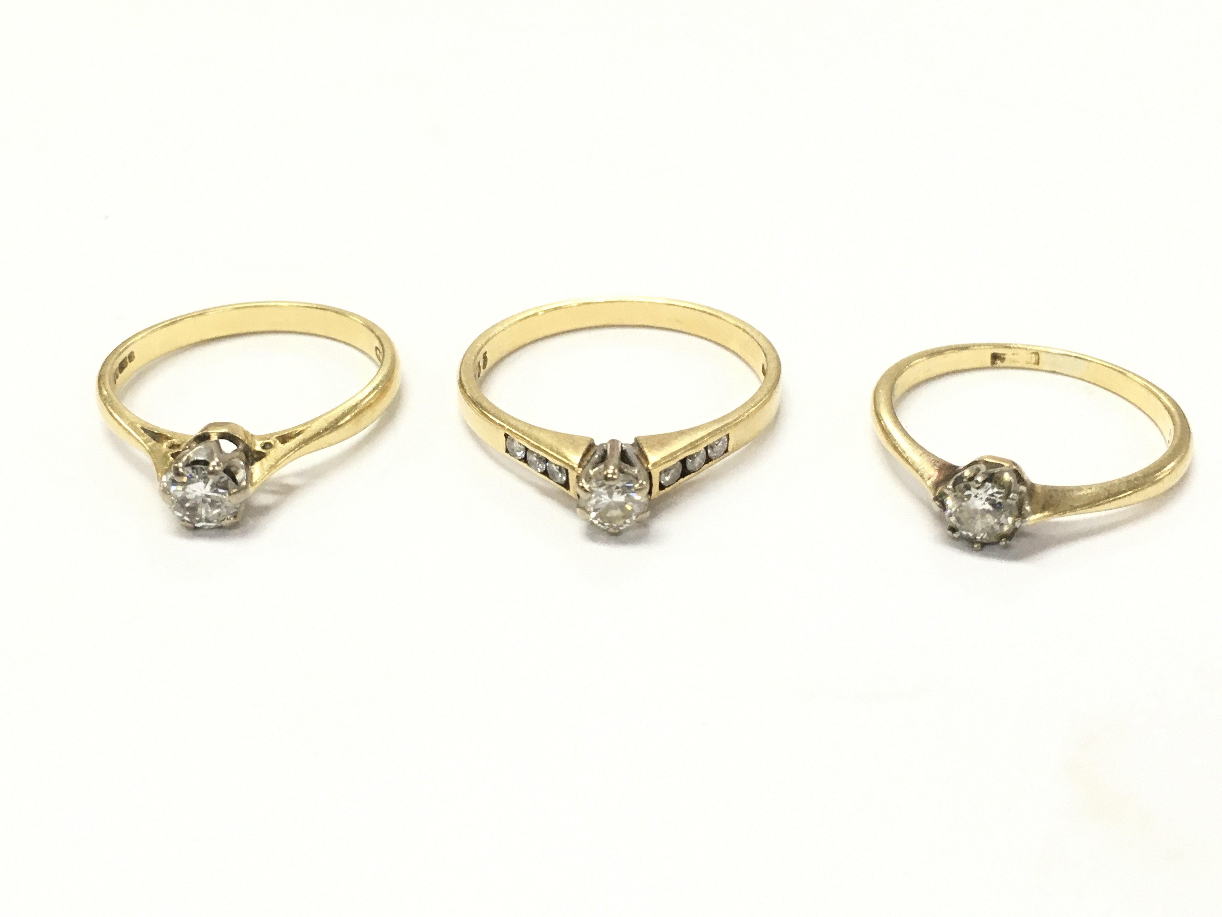 18ct gold diamond solitaire rings , 6.9g total weight. Size L, Q, M Postage category A