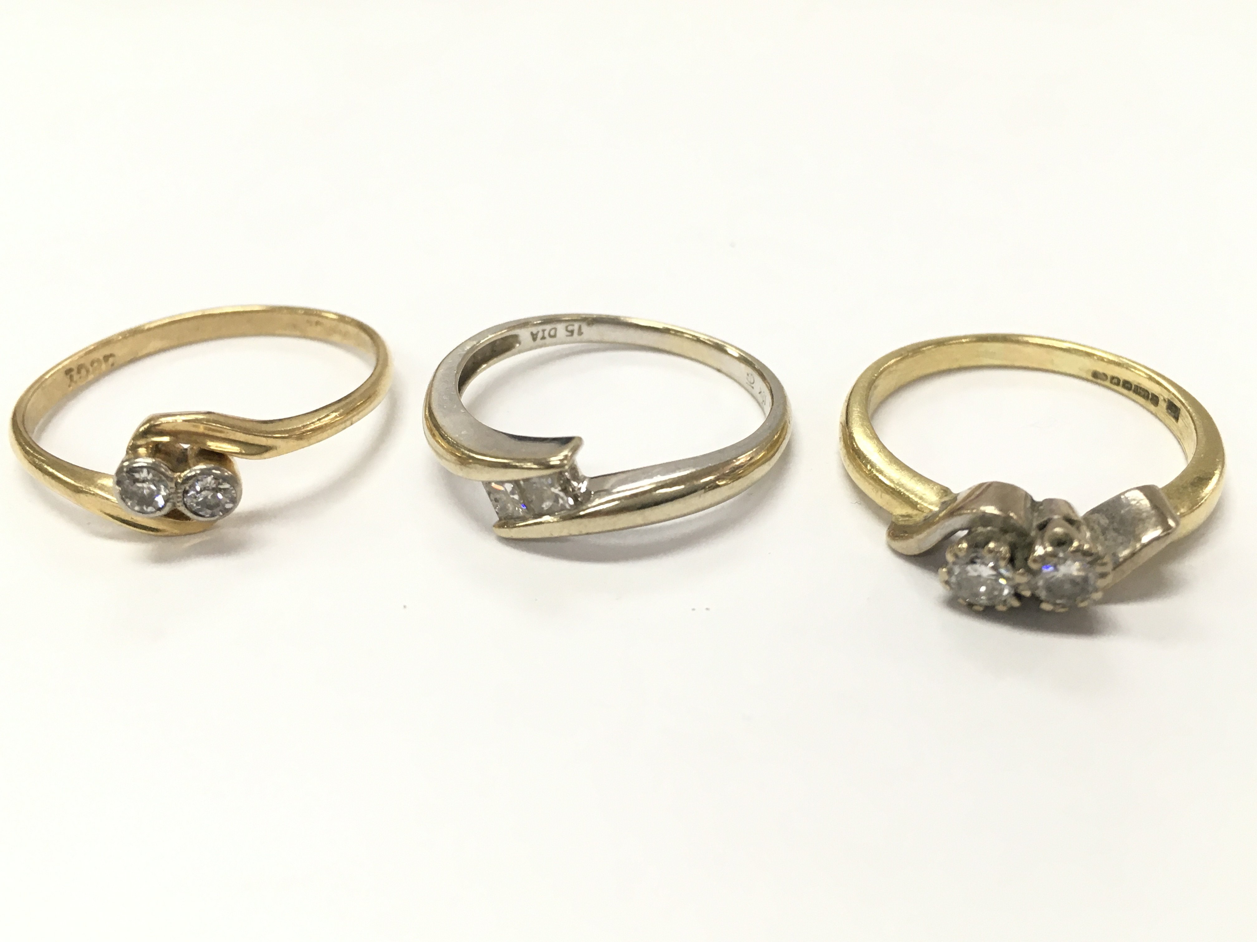 18ct gold two stone diamond rings. Size M, N, T, 8.8g total weight. Postage category A