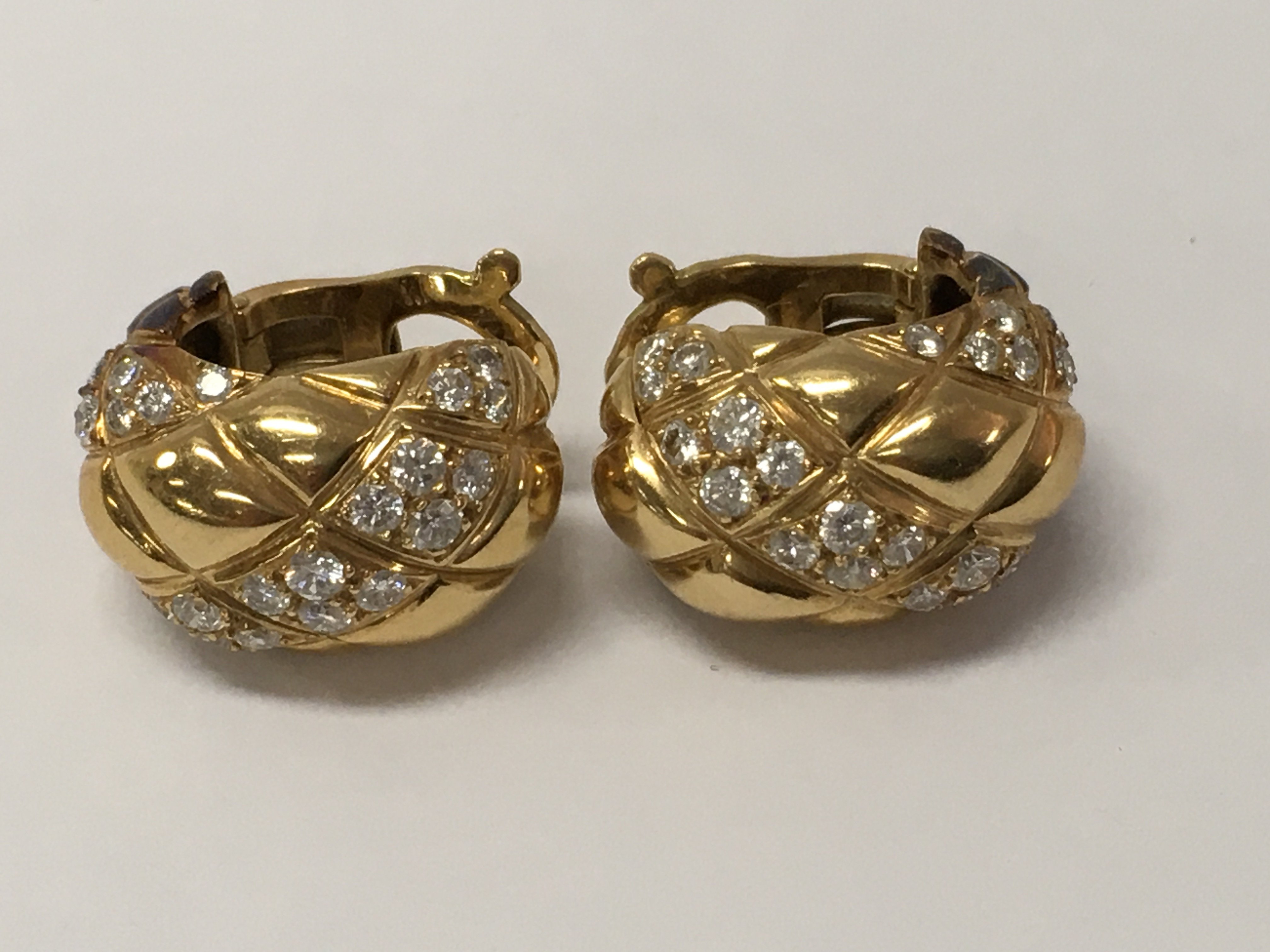 A pair of 18ct Van Cleef + Arpels diamond set ear clips 1.5cm numbered B3250 A9 With original leather pouch.