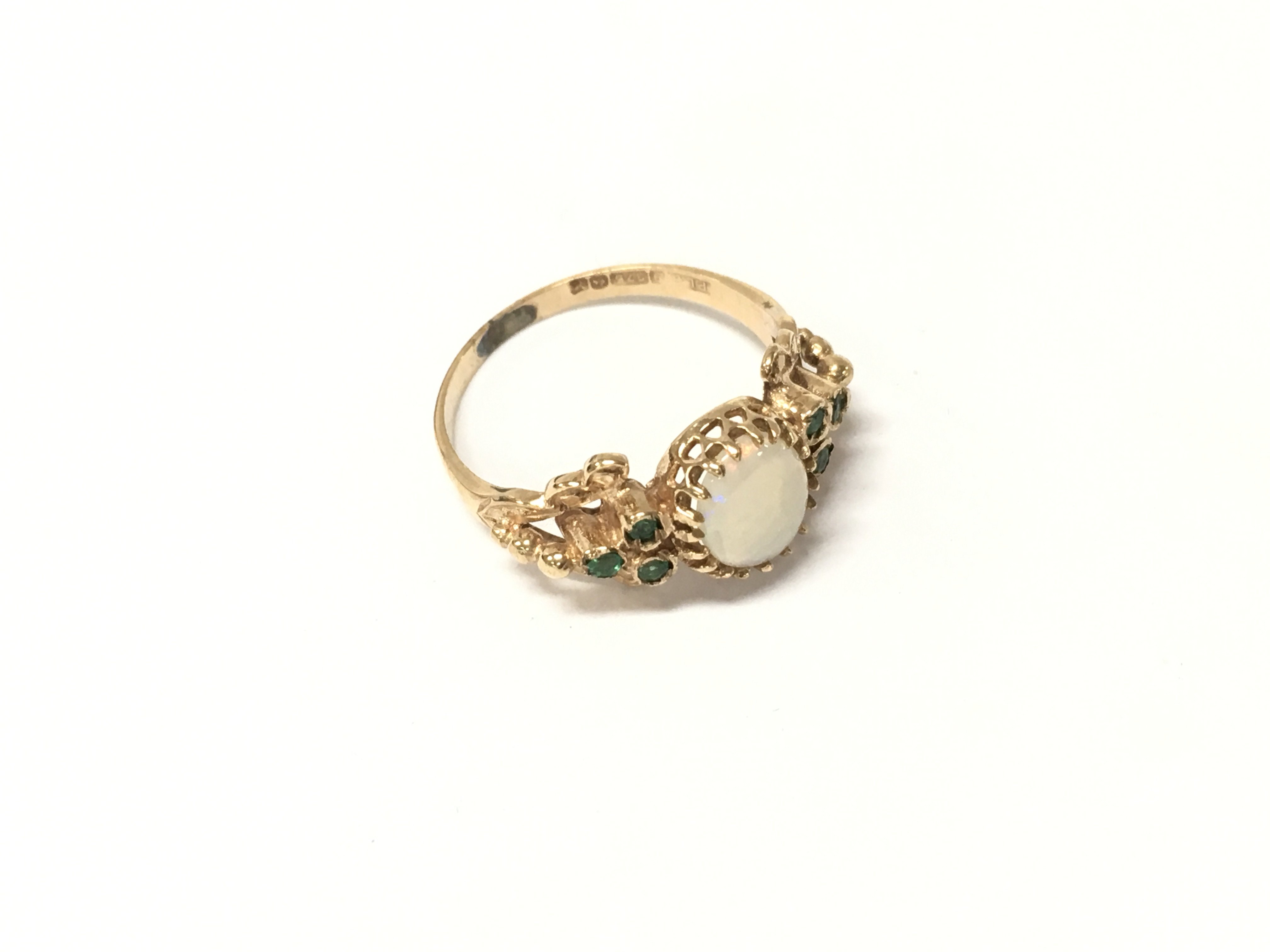 A 9ct gold emerald and opal set ring, Approx weight 2.18 grams, Approx size M.