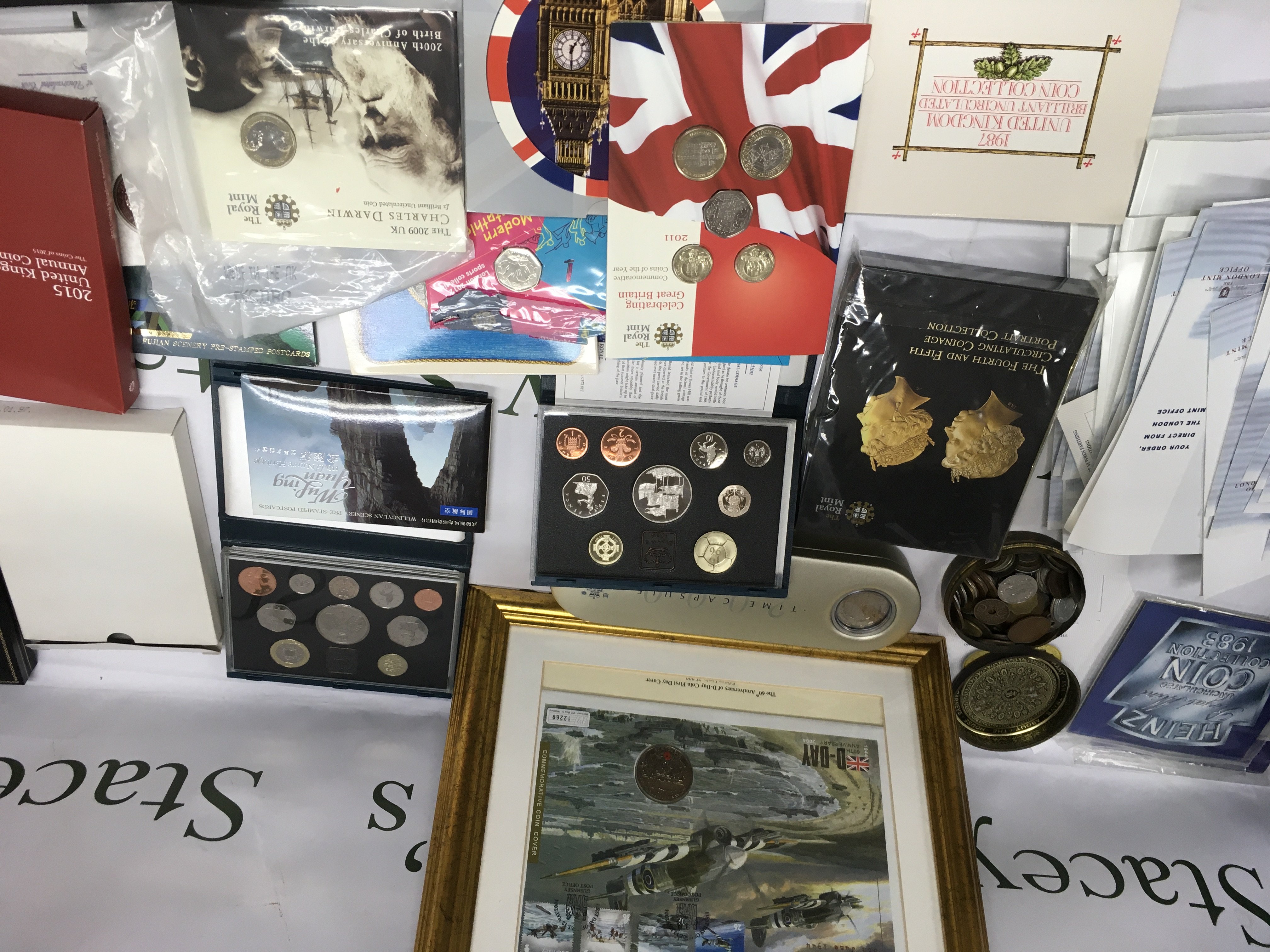 Two boxes containing Royal mint coins commemorative and uncirculated including nine Annual coin Sets London 50p and loose coinage various.