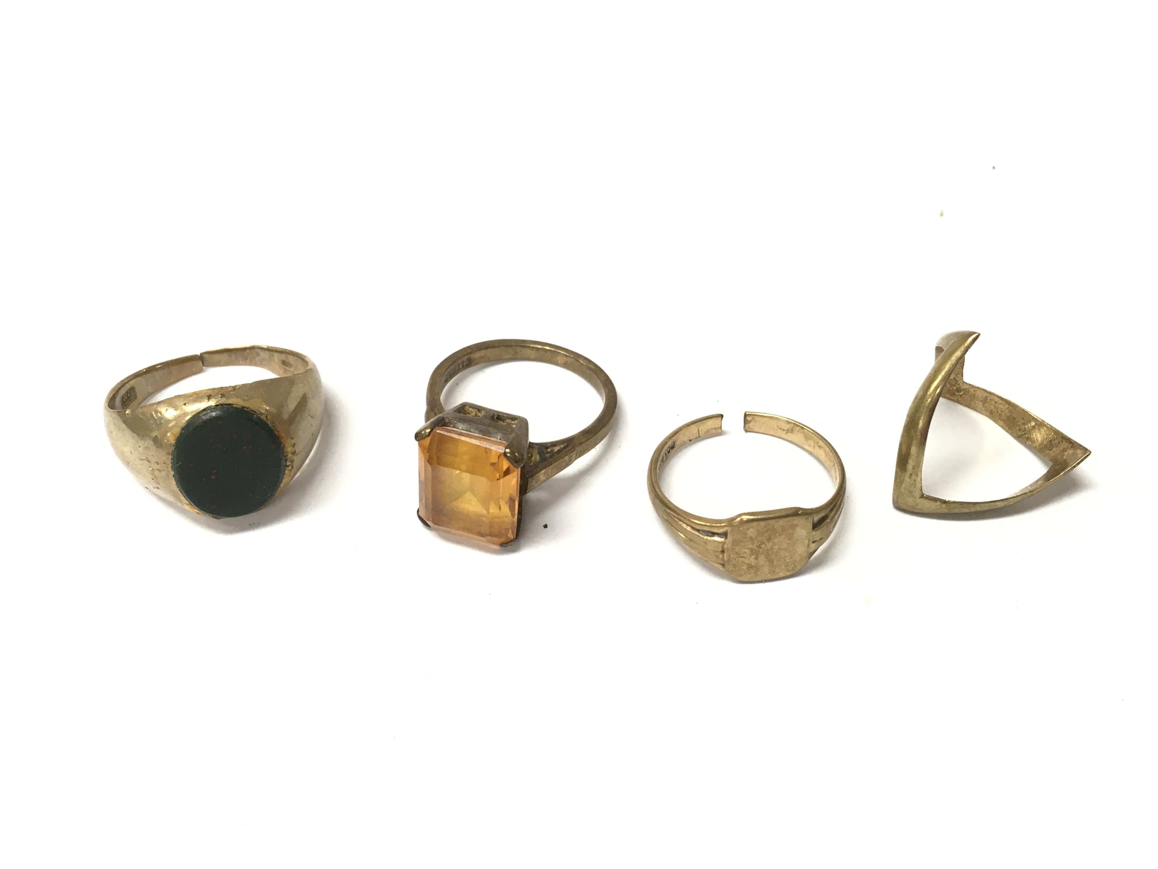 Four 9ct gold rings, Approx weight 14.67 grams.