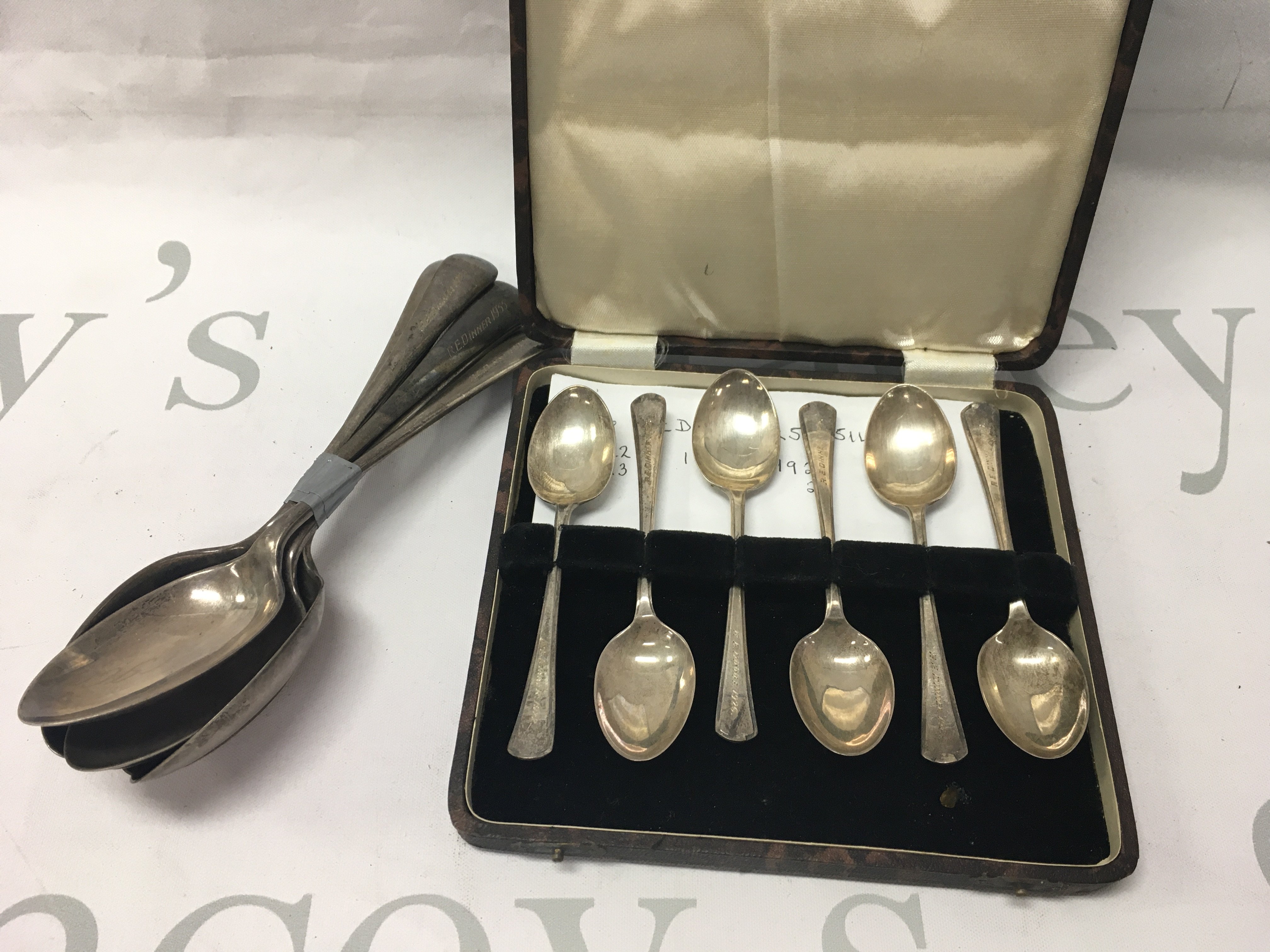 A set of six silver spoons and a cased set of six silver tea spoons. 315 grams.