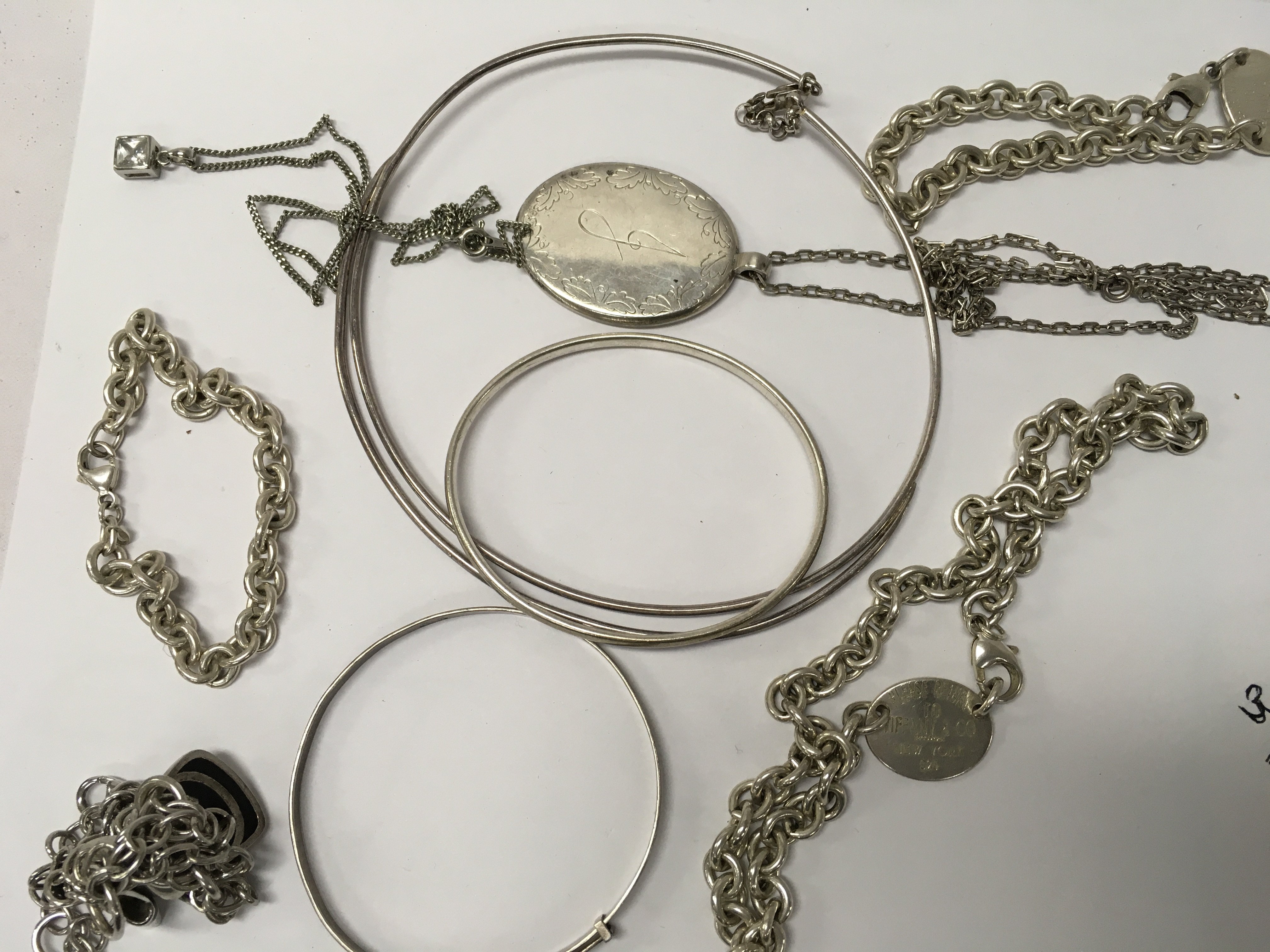 A collection of jewellery including silver including bracelets and necklaces.