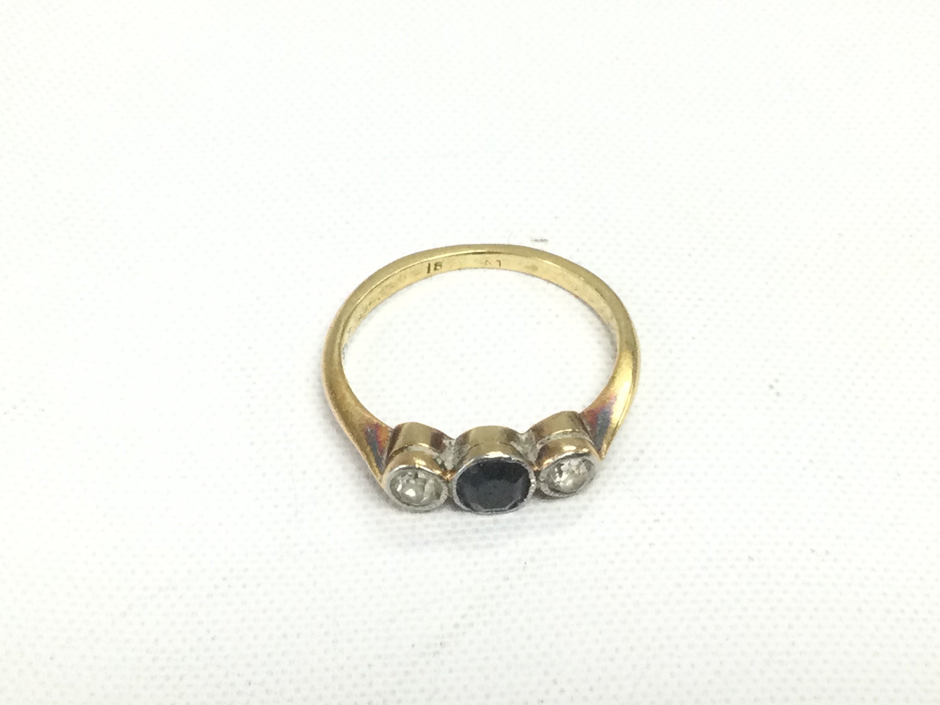 An 18ct gold sapphire and diamond ring, approx 2.2g and approx size K. Shipping category A.