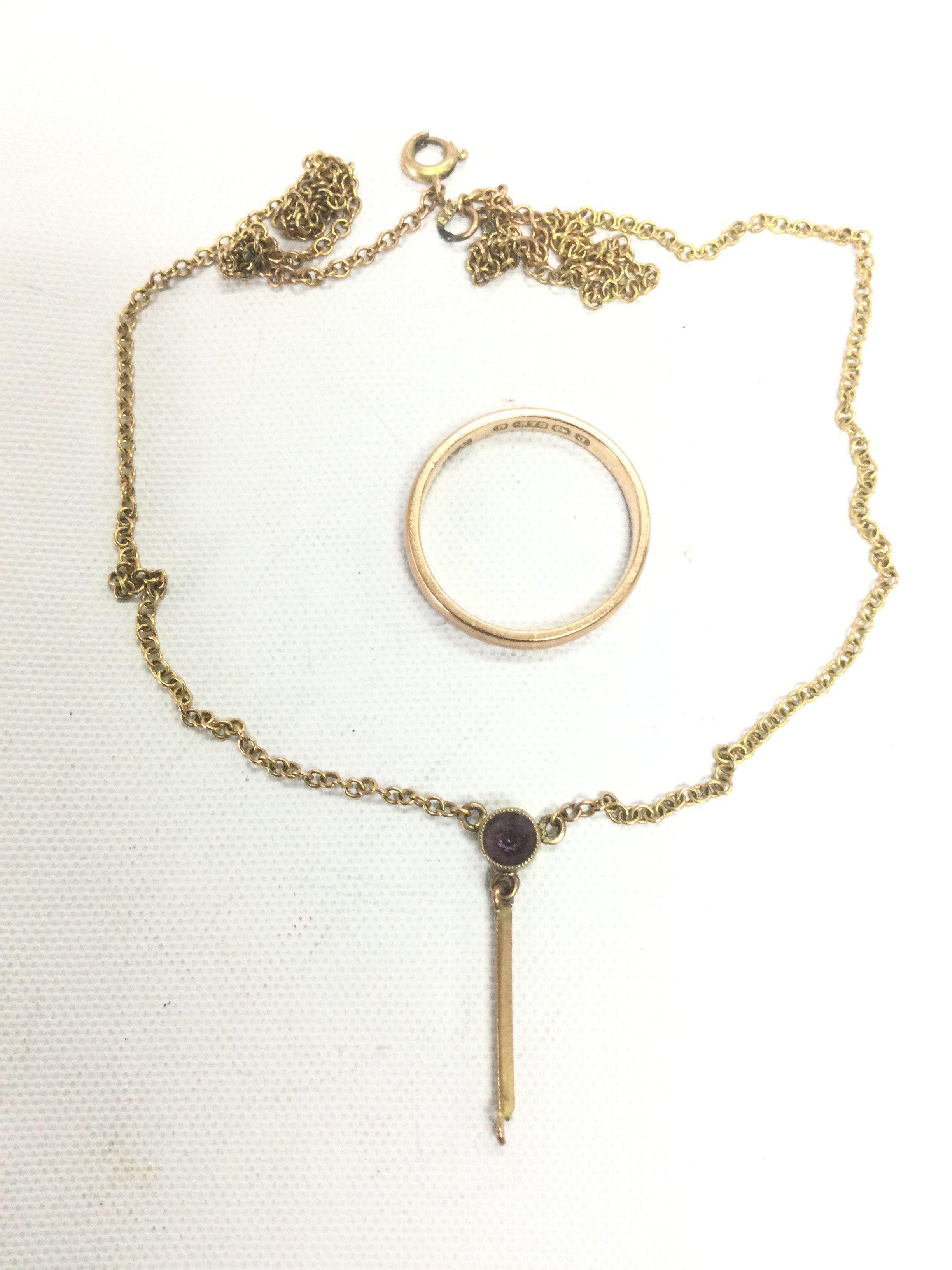 A 9ct gold wedding band and a pendant on chain. Shipping category A.