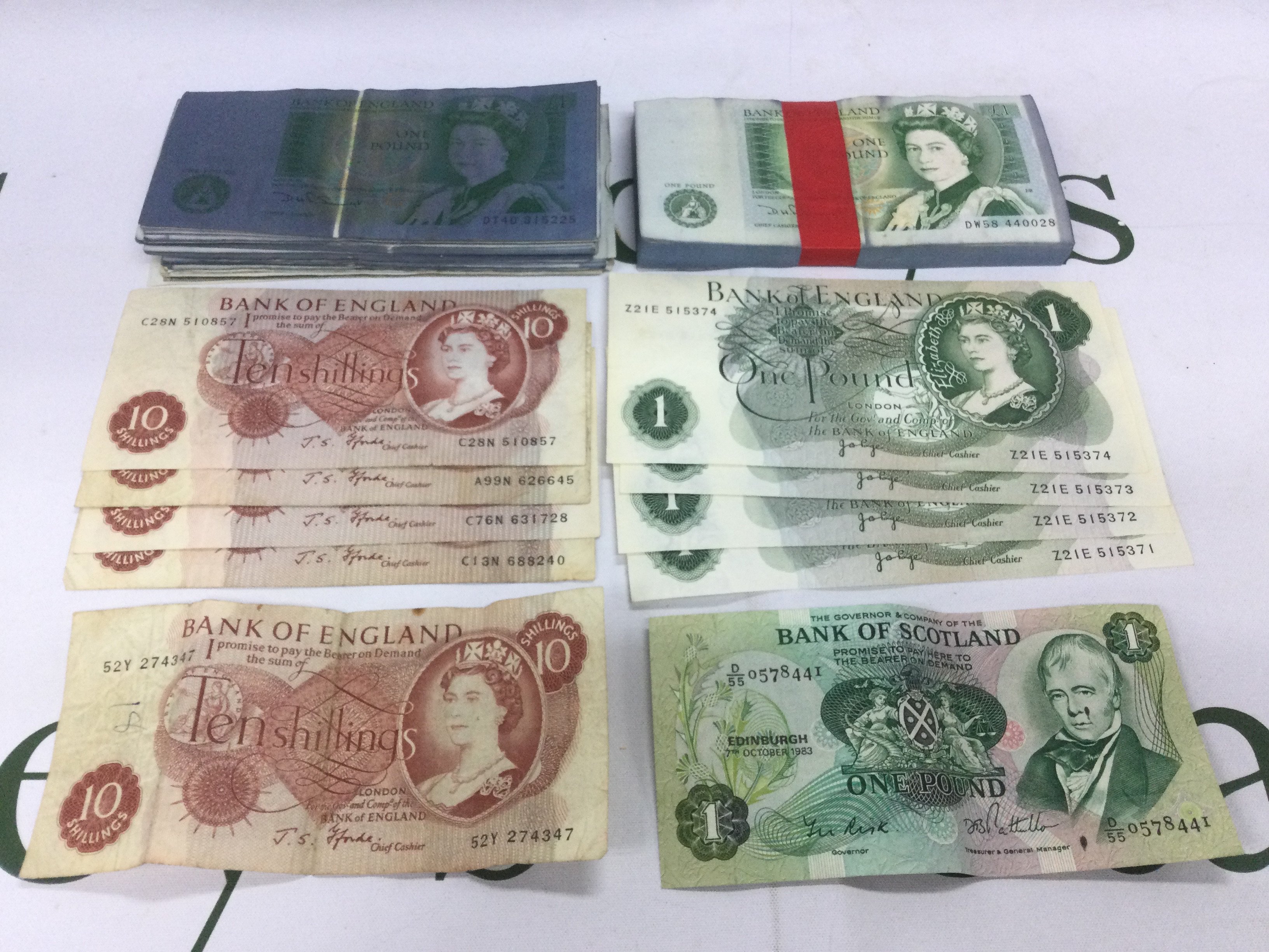 A collection of GB bank notes including a bundle of &#20132662751 wrapped notes and approx 100 loose bank notes and shillings. Shipping category A.