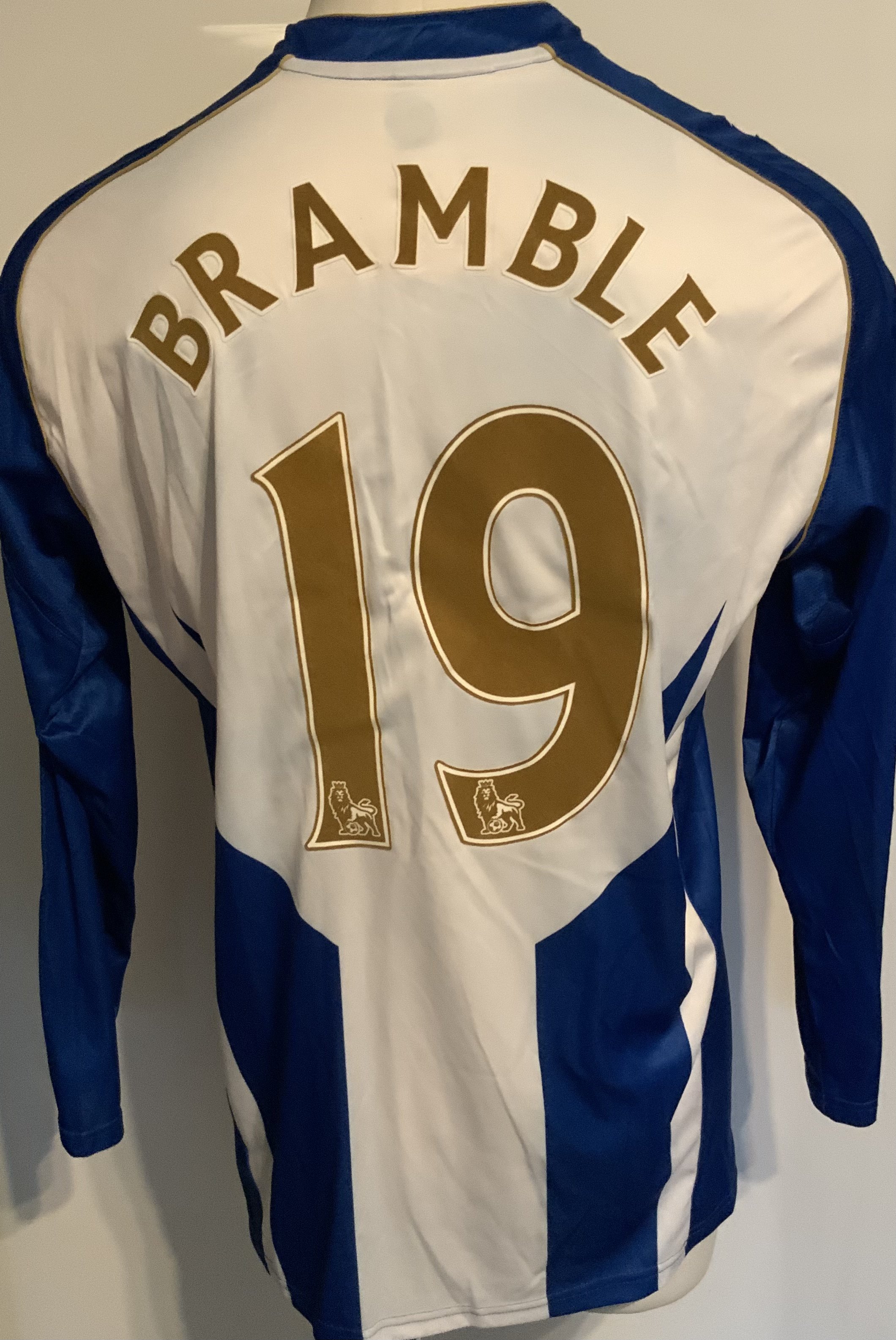 Wigan Athletic 2009 - 2010 Match Worn Football Shirt: Worn v Arsenal on 21 9 2009. Blue and white long sleeve with Premiership badging to arms and number 19 Bramble to rear.