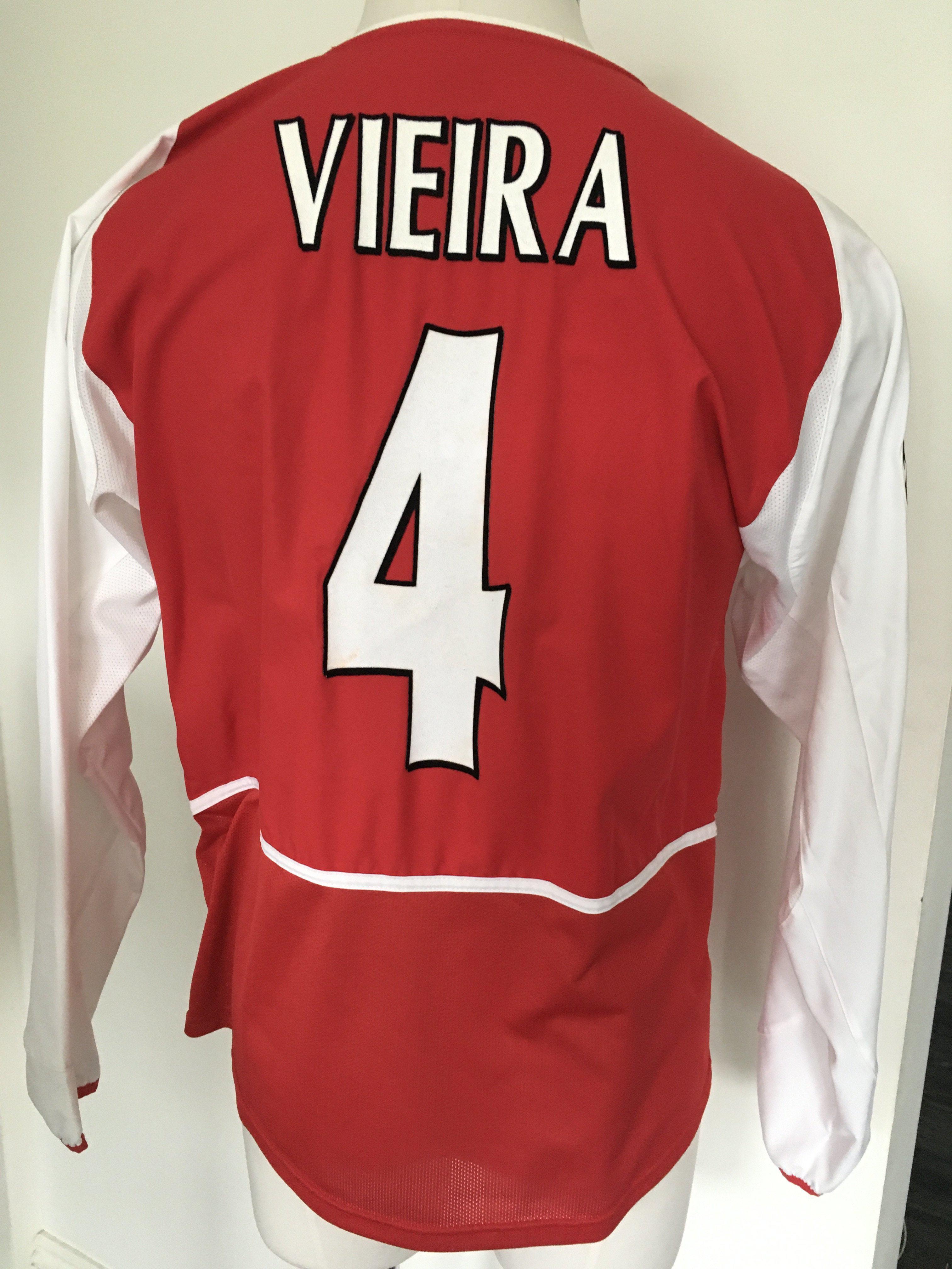 Viera Arsenal Match Worn Football Shirt: Red long sleeve Champions League shirt with number 4 Viera to rear. Champions League badge to right arm and swear patch to chest.