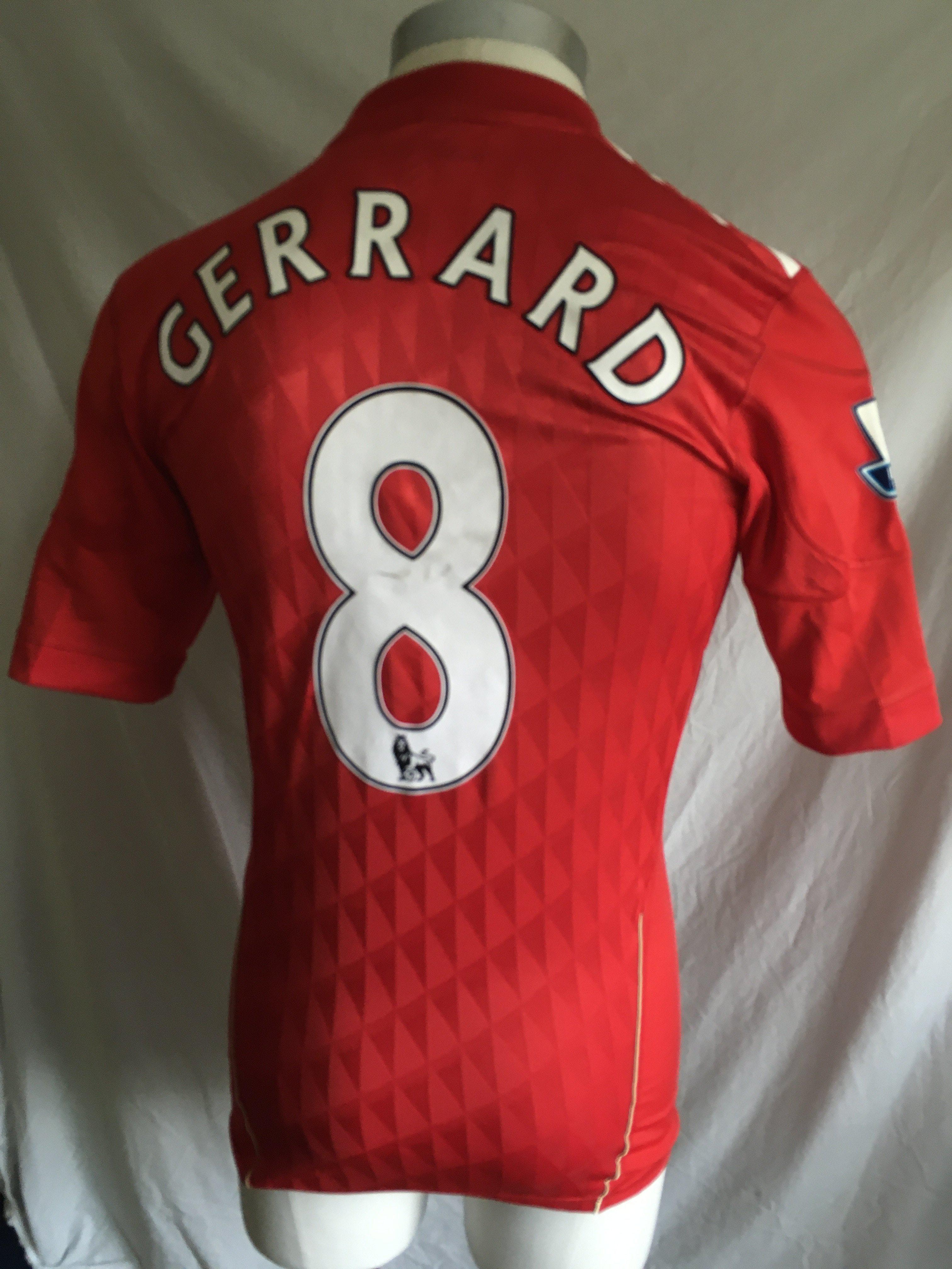 Gerrard 2010 - 2012 Liverpool Match Worn Football Shirt: Red number 8 with Gerrard to rear. Premier League badging to arms. Signed to front by Gerrard.