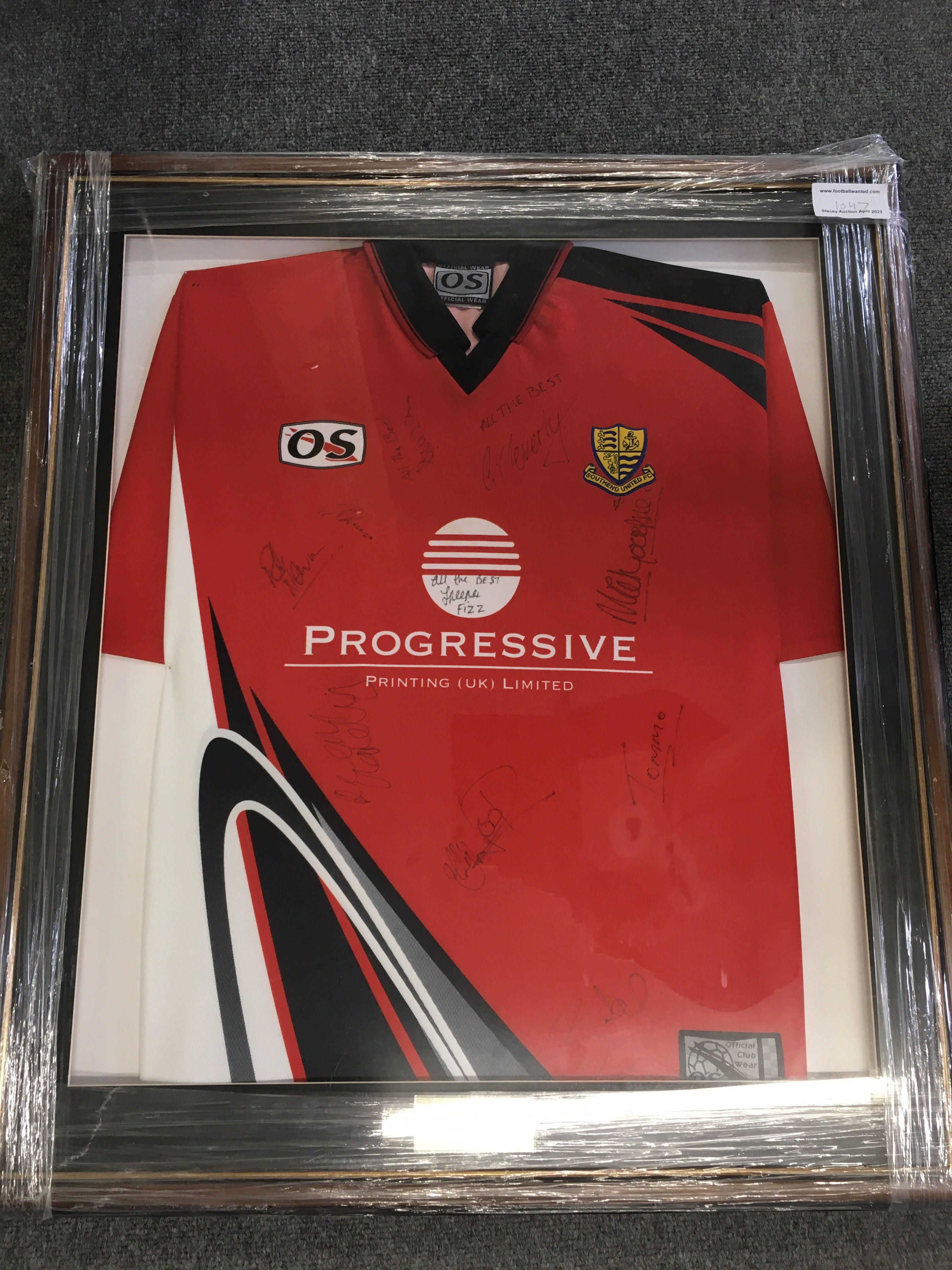 Southend United Signed Framed Shirt + More: Red away shirt from 98/99 signed by 9 and nicely framed. C/W. Signed ball from around 2011 plus a multi signed large 2014/2015 poster.