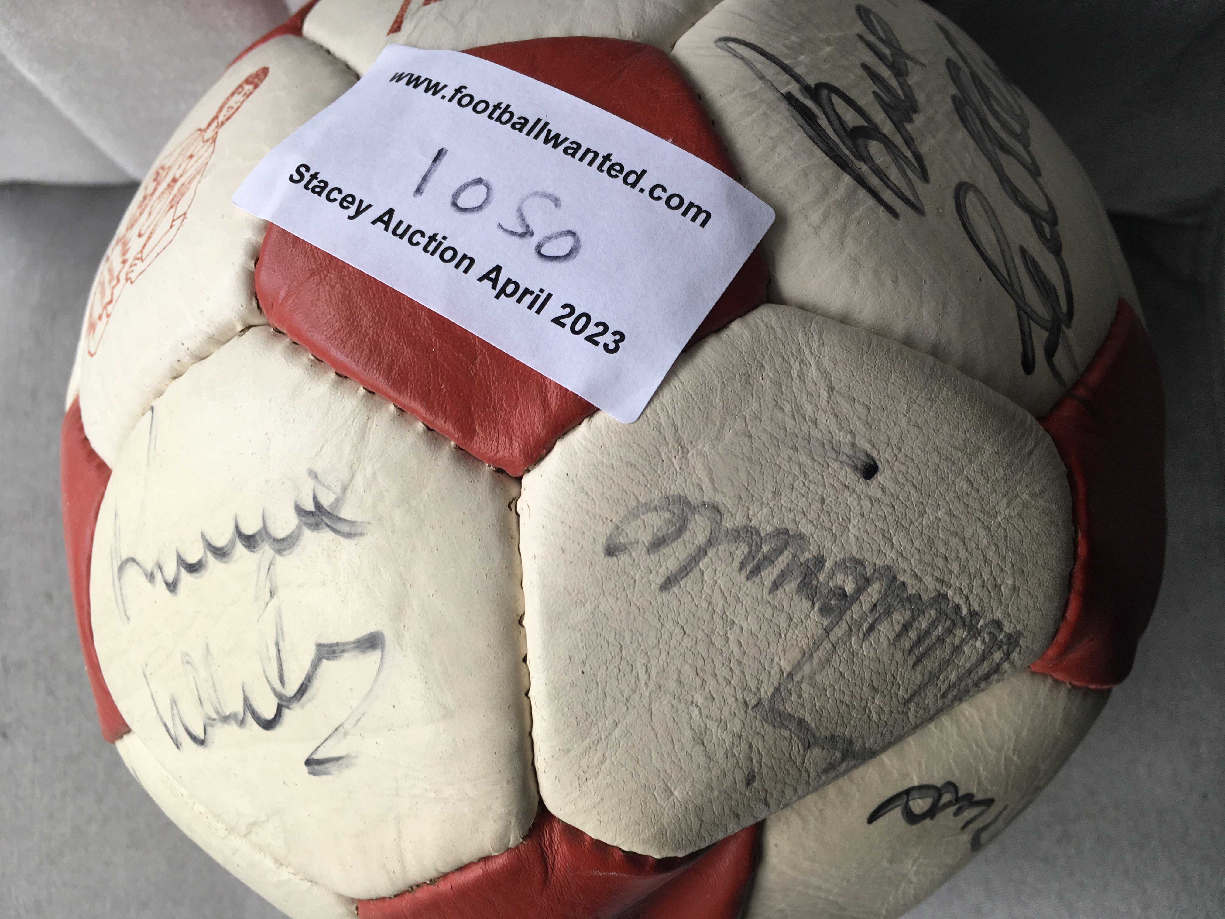 Liverpool Signed Football: Original red and white panelled football with autographs of Grobbelaar, Rush, Lawrenson, Dalglish, Whelan and others from the late 80s. 14 signatures in marker pen.