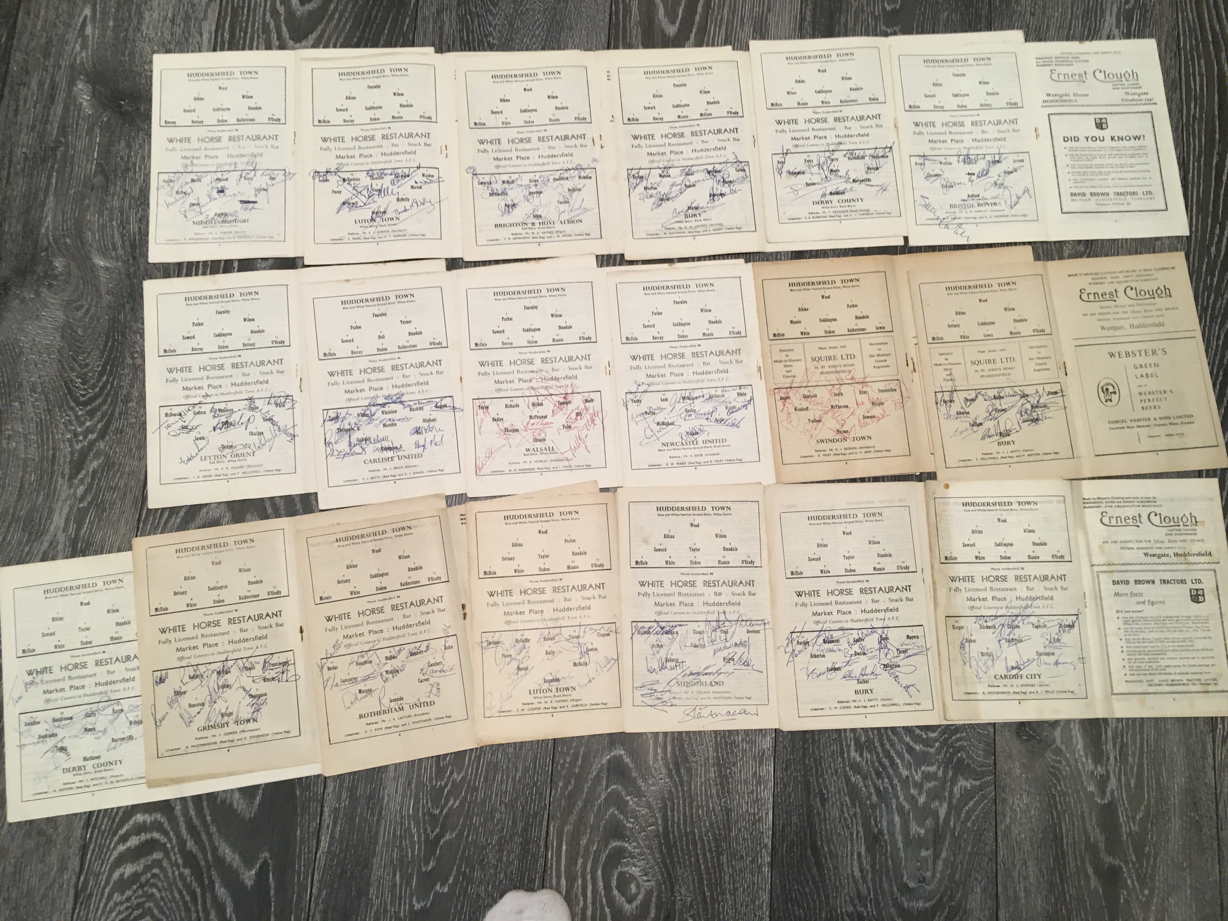 Early 60s Division 2 Fully Signed Football Programmes: Huddersfield home programmes from 61/62 and 62/63 fully signed by the opposition team on the team page. Former property of Ray Wood, the Huddersfield and Manchester United goalkeeper. Teams include Derby, Cardiff, Bury, Sunderland, Luton, Rotherham, Grimsby, Swindon, Newcastle, Walsall, Carlisle, Orient, Bristol Rovers, Brighton and Middlesbrough. Good condition and a nice lot. (22)