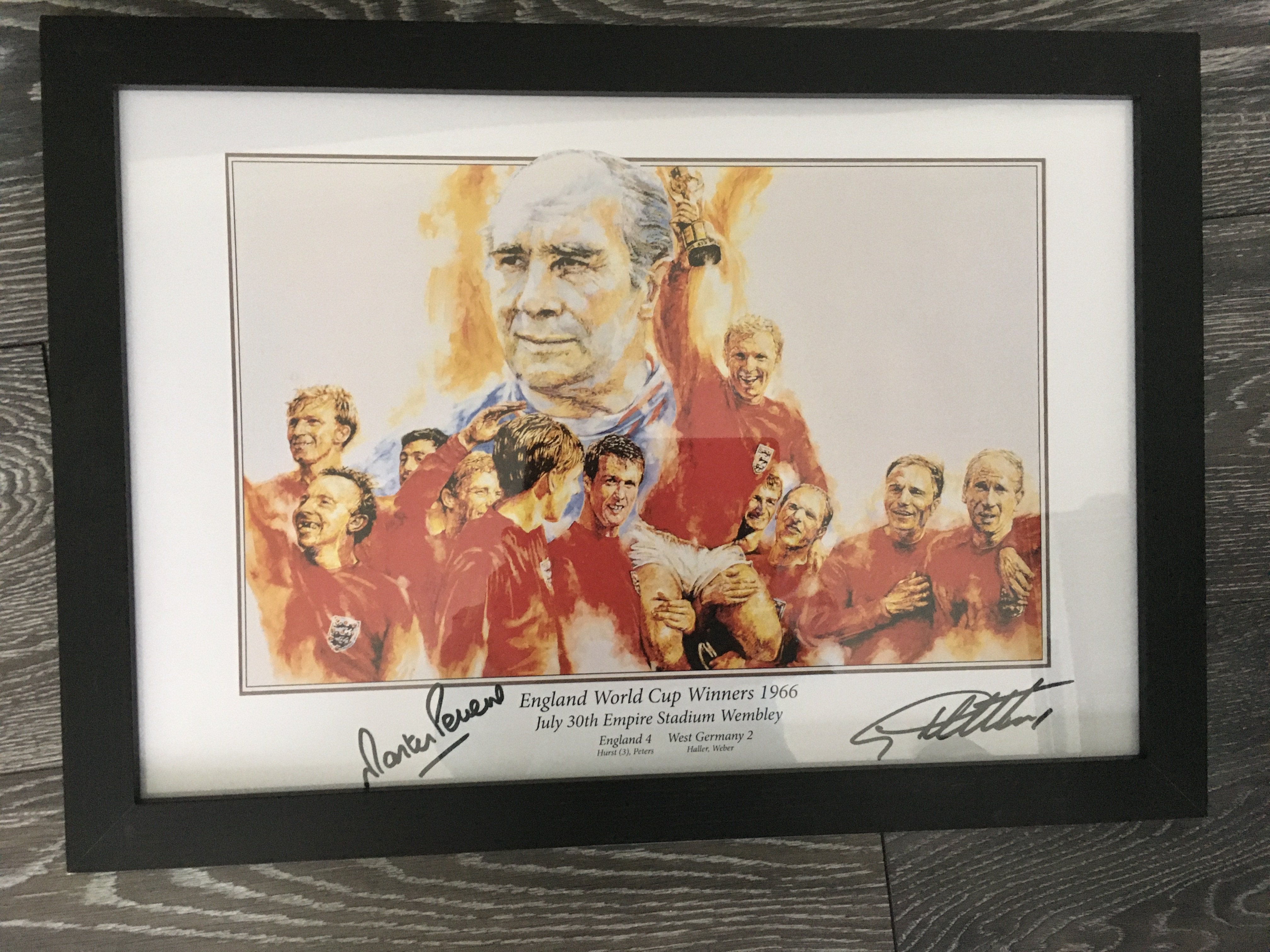 Hurst + Peters Signed England 1966 Football Memorabilia: Red long sleeve England final replica shirt and an attractive framed print both items hand signed by the winning goalscorers. Frame easily removed from print for sending.