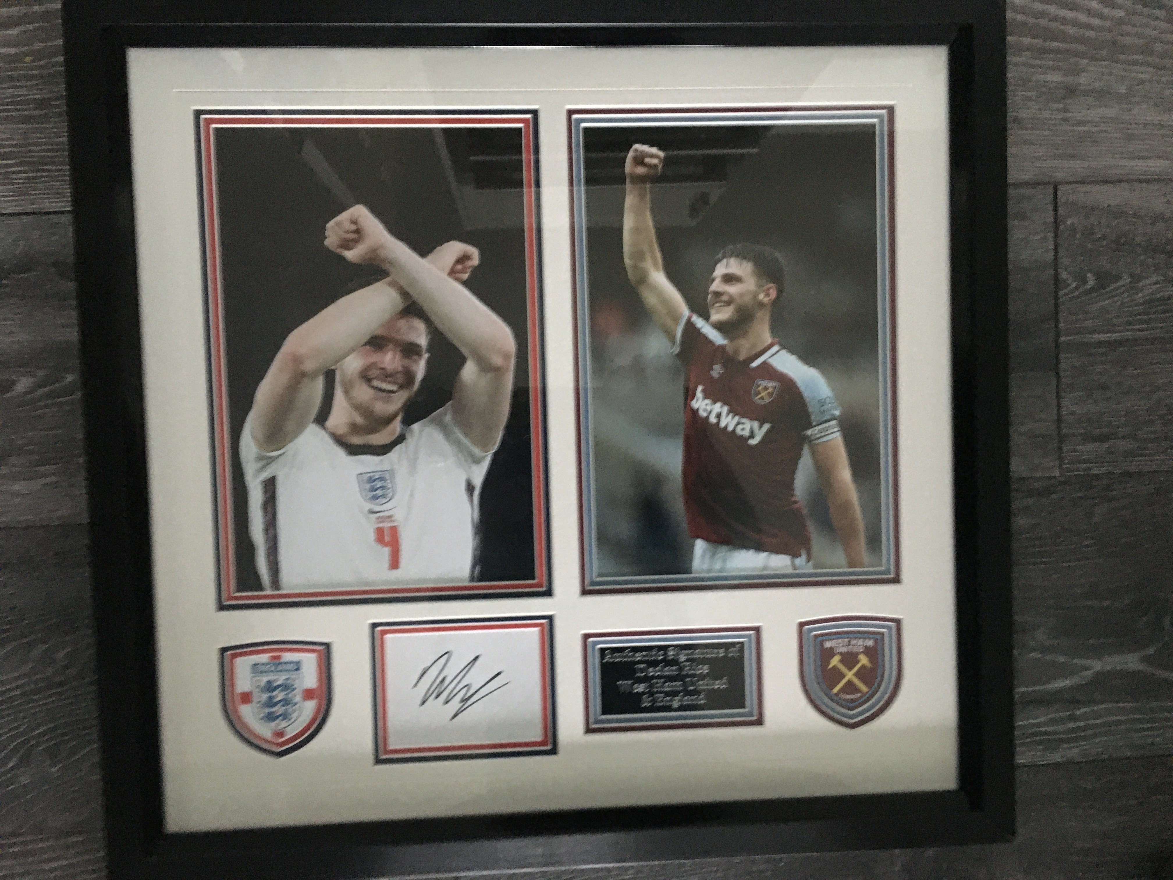 Declan Rice West Ham + England Signed Framed Photo: Beautifully framed item definitely for the West Ham fan. Two separate large photos of Rice in West Ham kit and then in England kit doing the Hammers sign. Nice plaques with colour coordinated double mounting and a white card signed. COA to rear.
