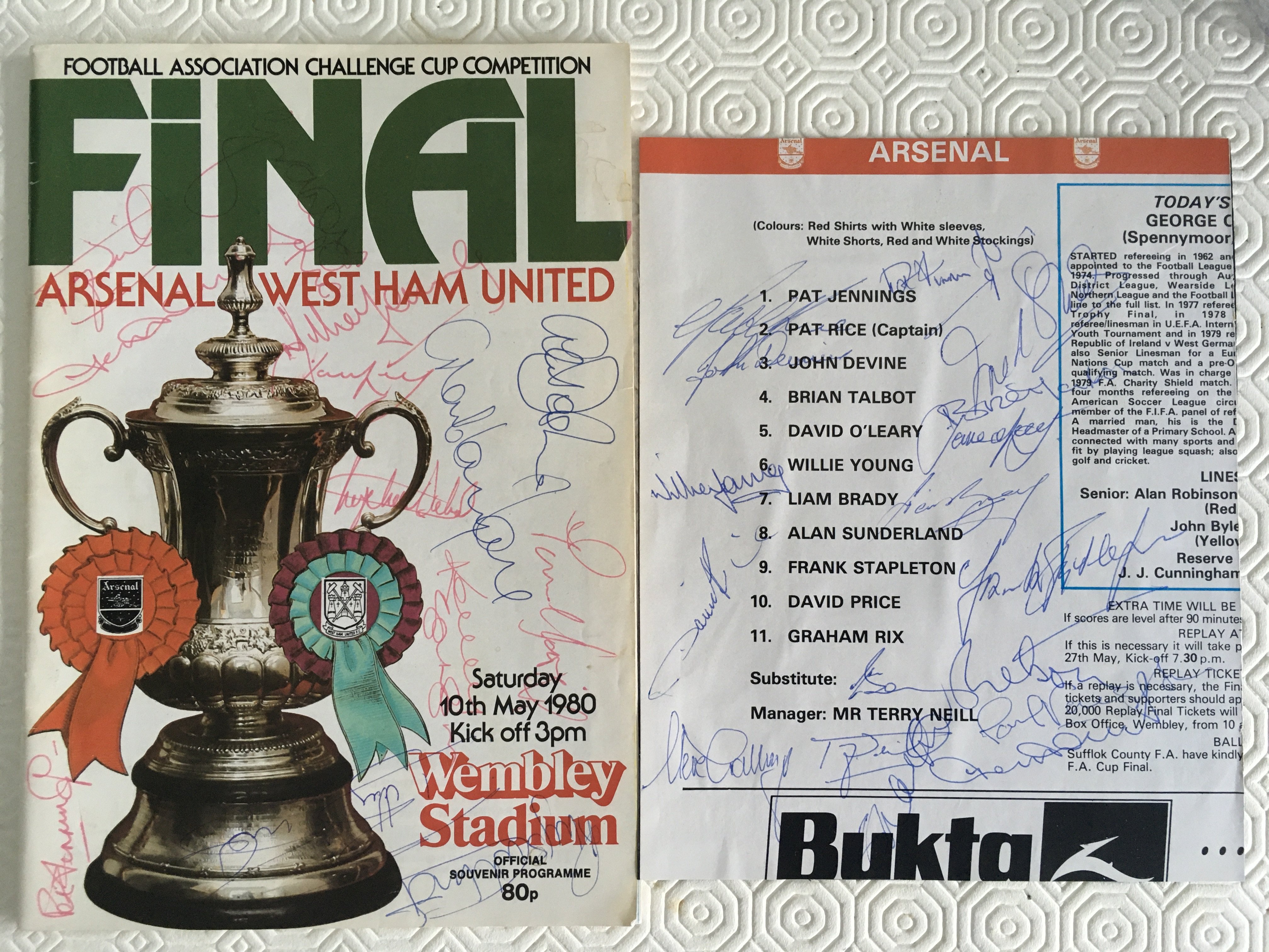 1980 FA Cup Final Signed Football Programme: Signed to front cover by 14 players from both teams. A further page removed from another programme and stuck down to card of the Arsenal squads autographs.