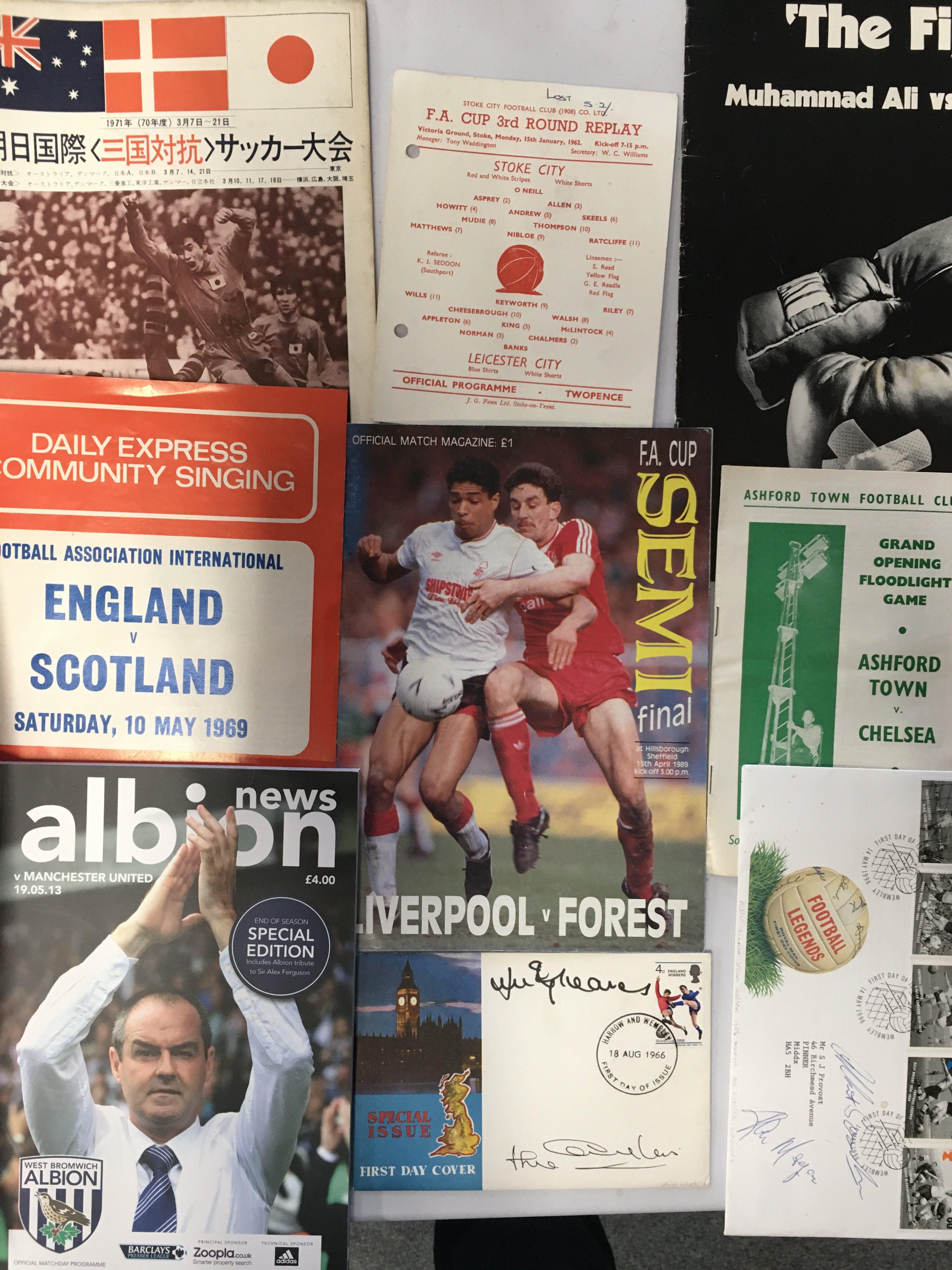 Football Programme + Memorabilia Box: Includes some interesting programmes worth a glimpse. C/W signed FDCs including J Charlton Greaves Busby Hurst Greenhoff Banks a menu signed by Charles Buchan plus many teams sheets and more.